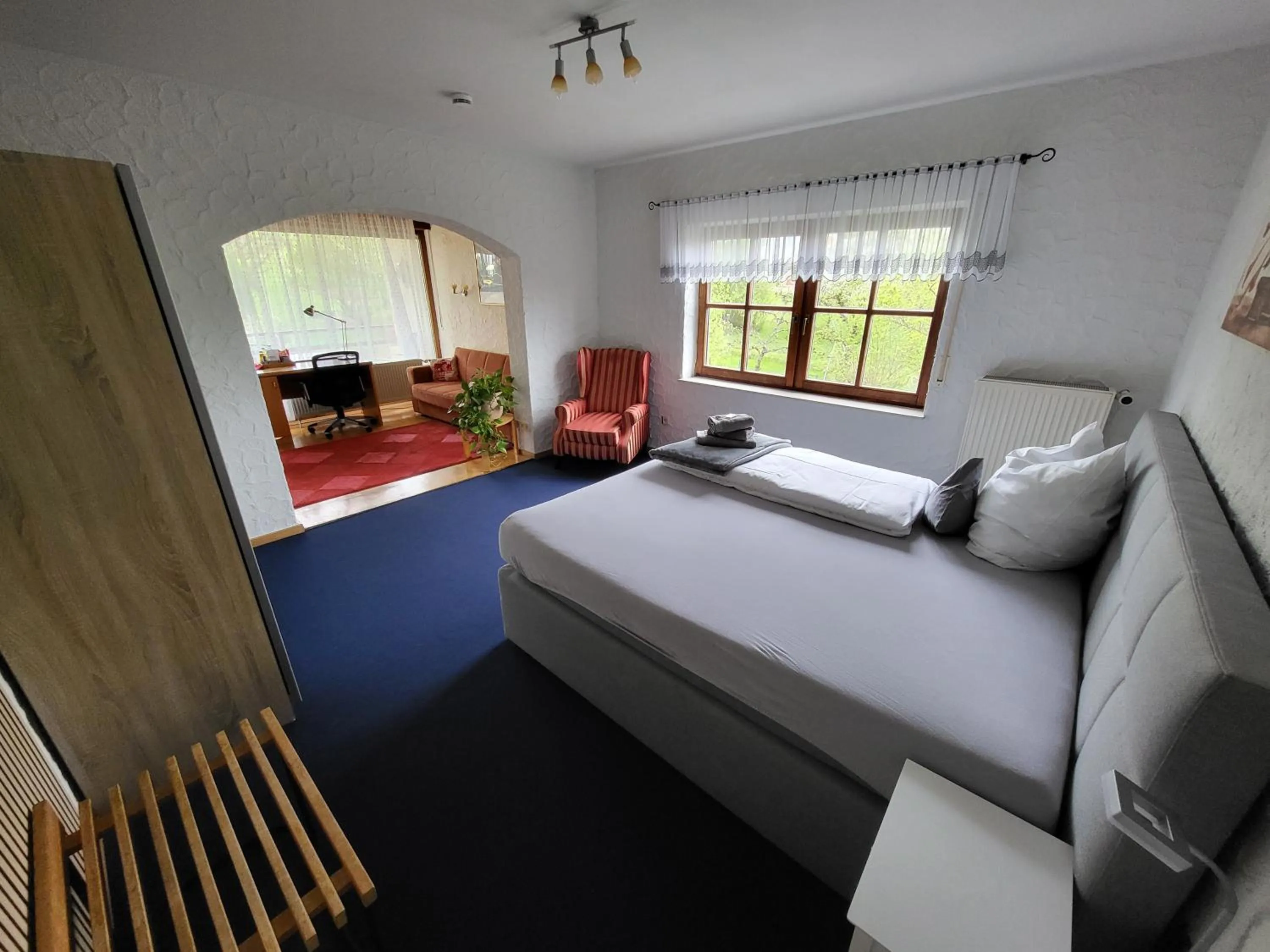 Seating area, Bed in Hotel Schönblick