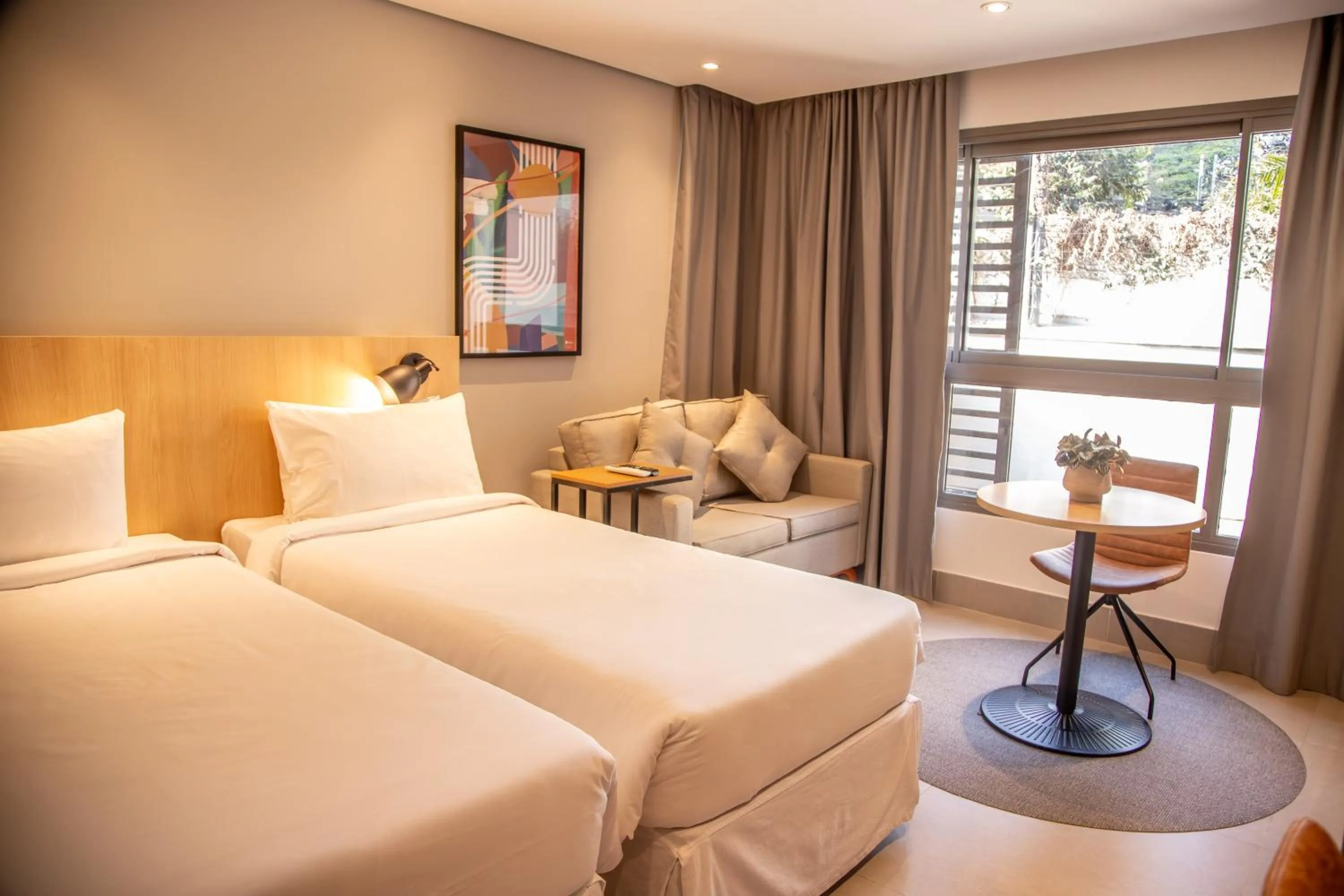 Bed in Cozzy Suites Paraíso Hotel