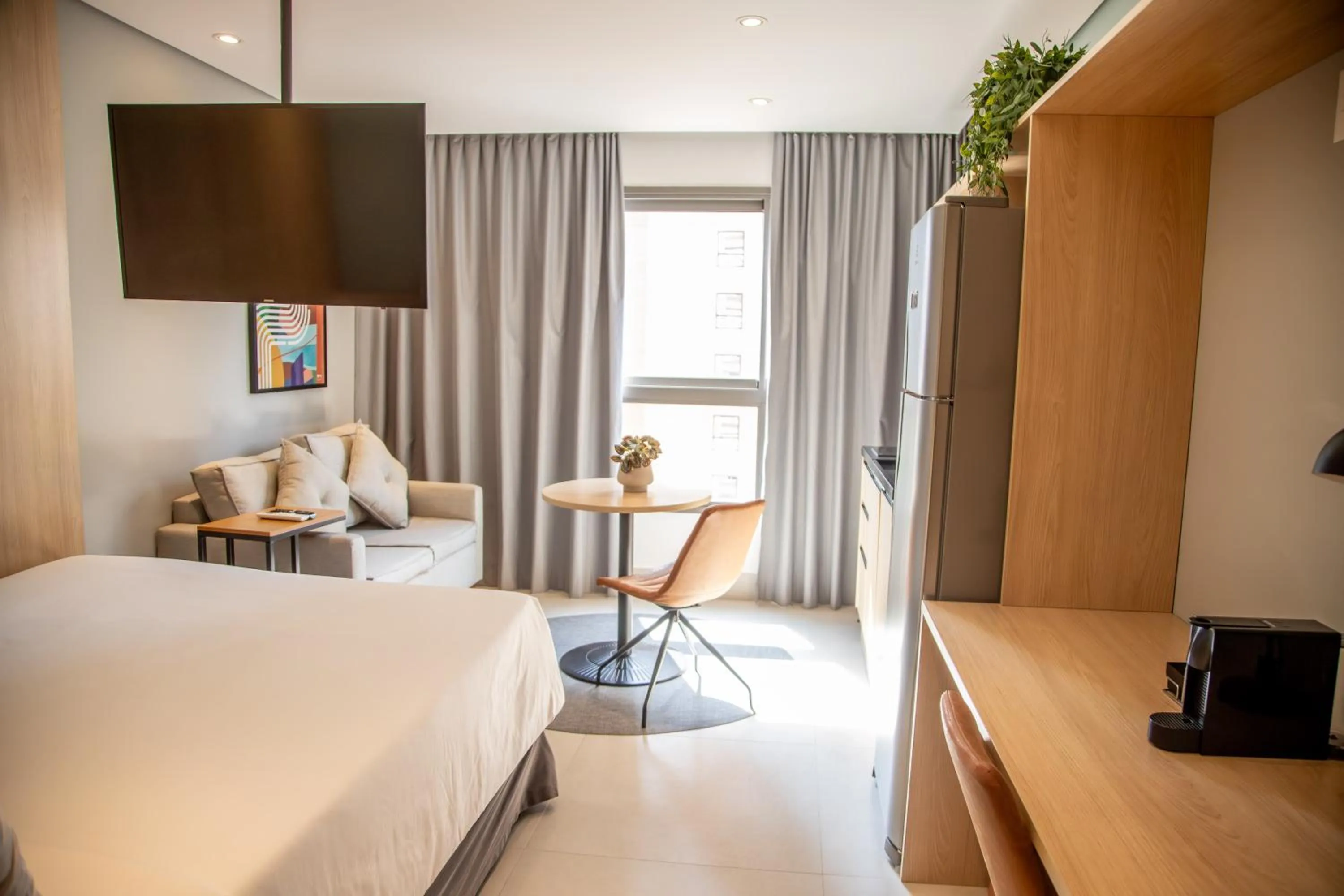 Bed in Cozzy Suites Paraíso Hotel