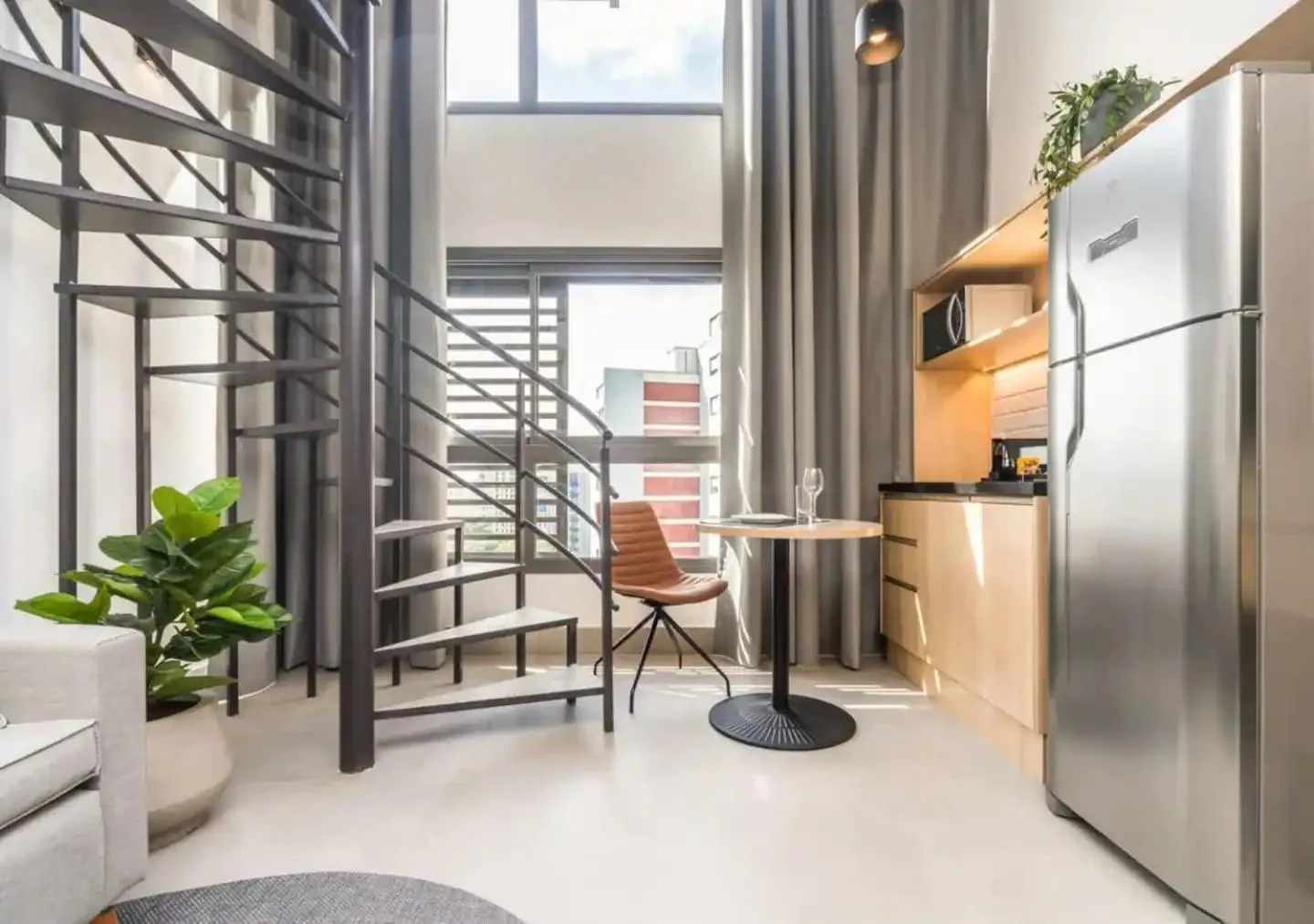 Kitchen or kitchenette in Cozzy Suites Paraíso Hotel