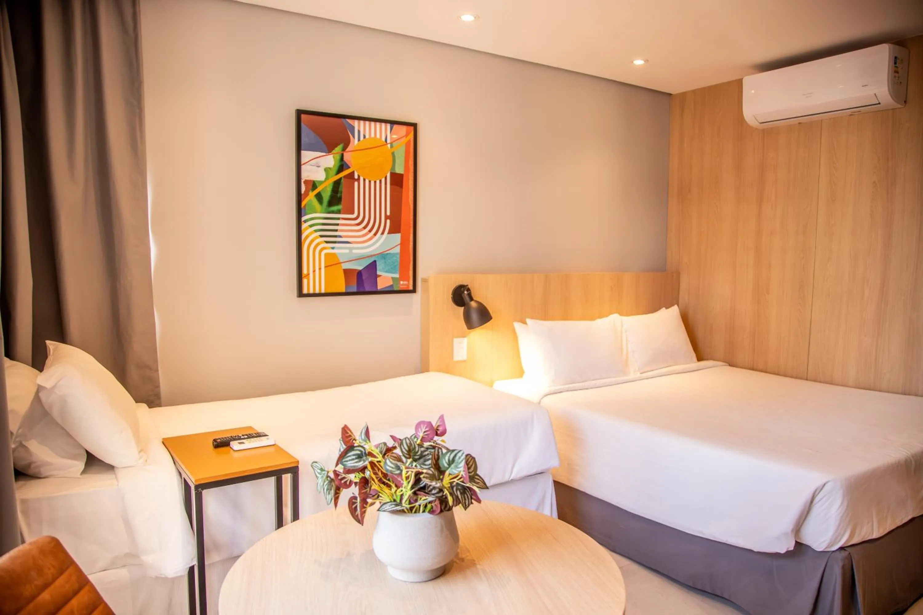 Bed in Cozzy Suites Paraíso Hotel