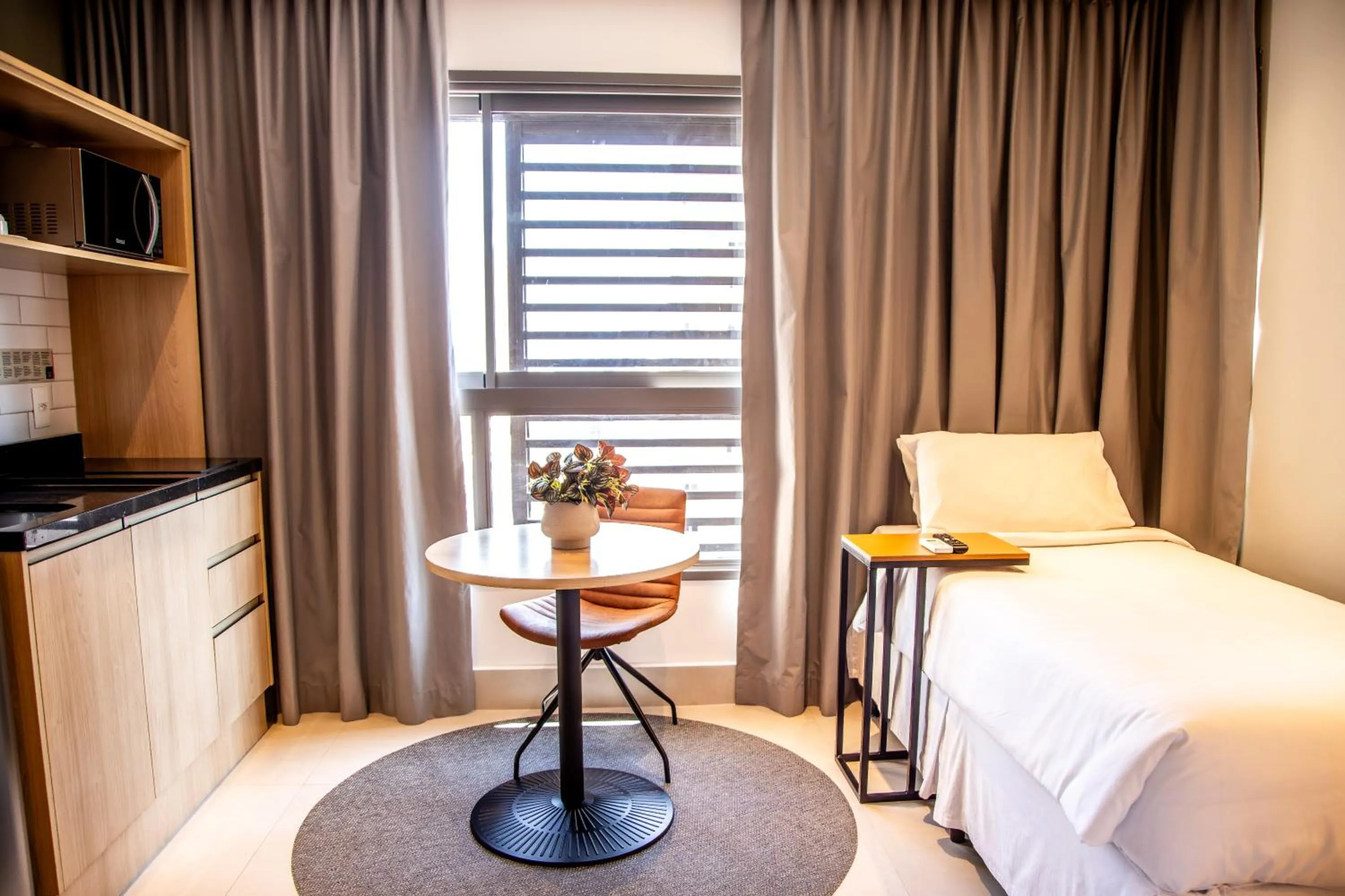 Bed in Cozzy Suites Paraíso Hotel