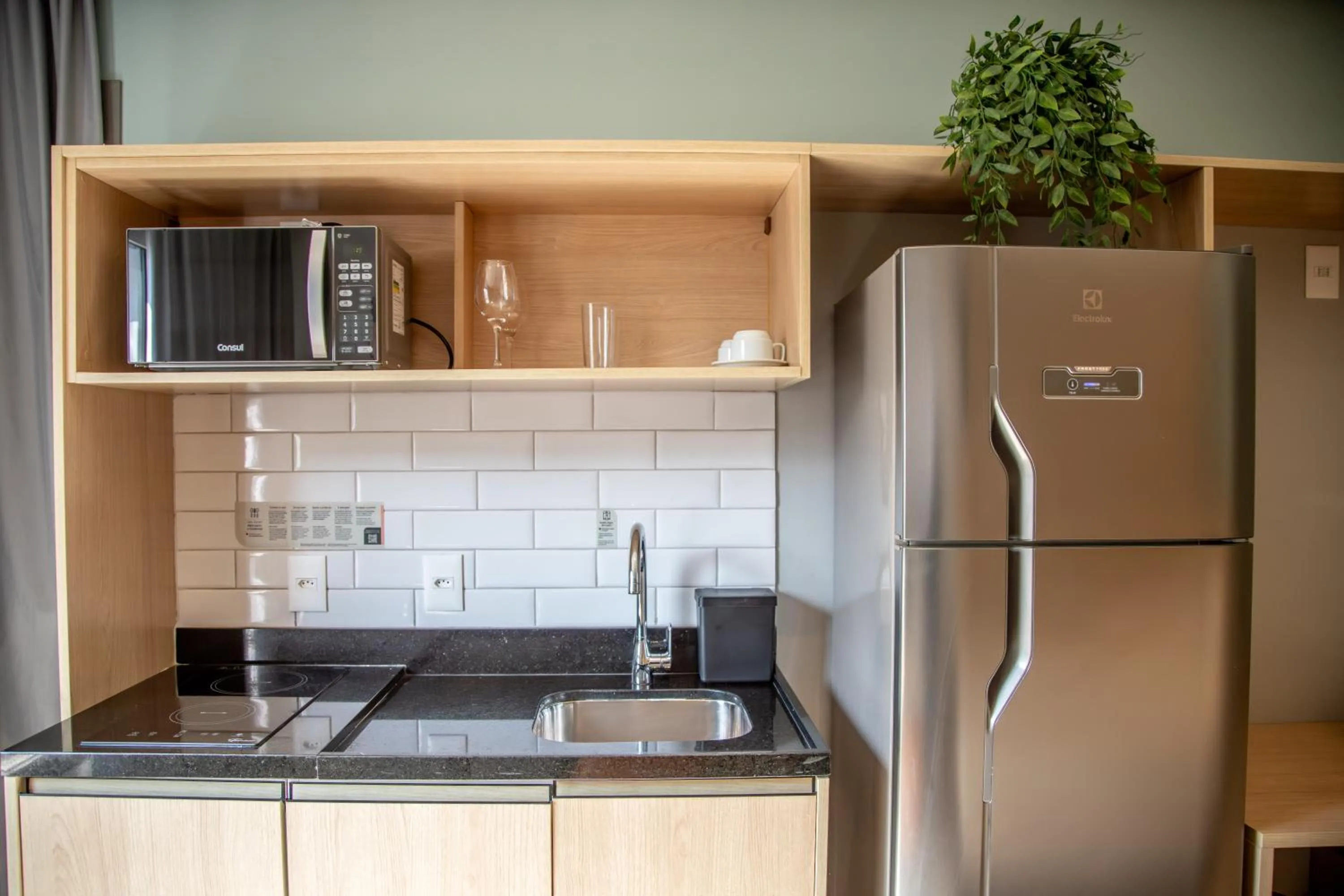 kitchen in Cozzy Suites Paraíso Hotel