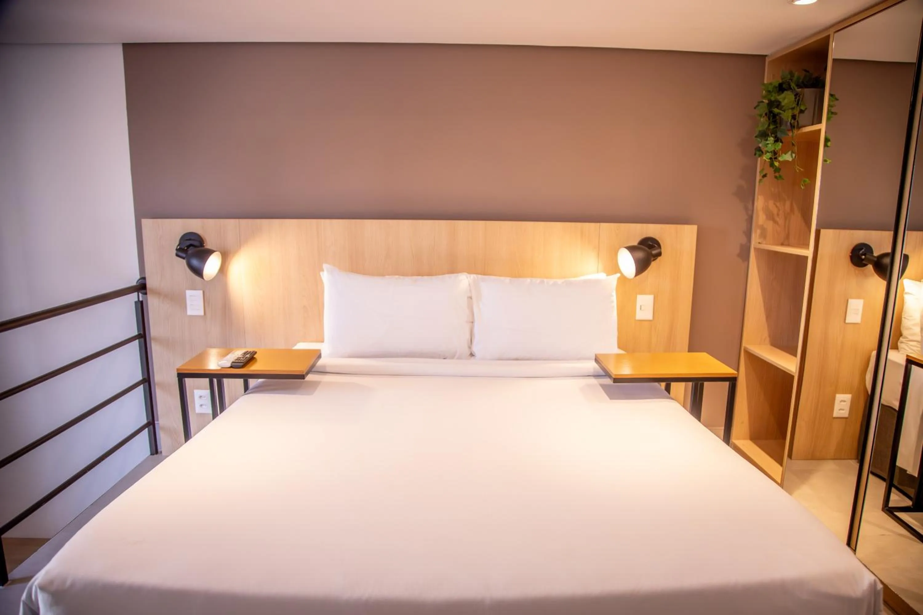 Bed in Cozzy Suites Paraíso Hotel