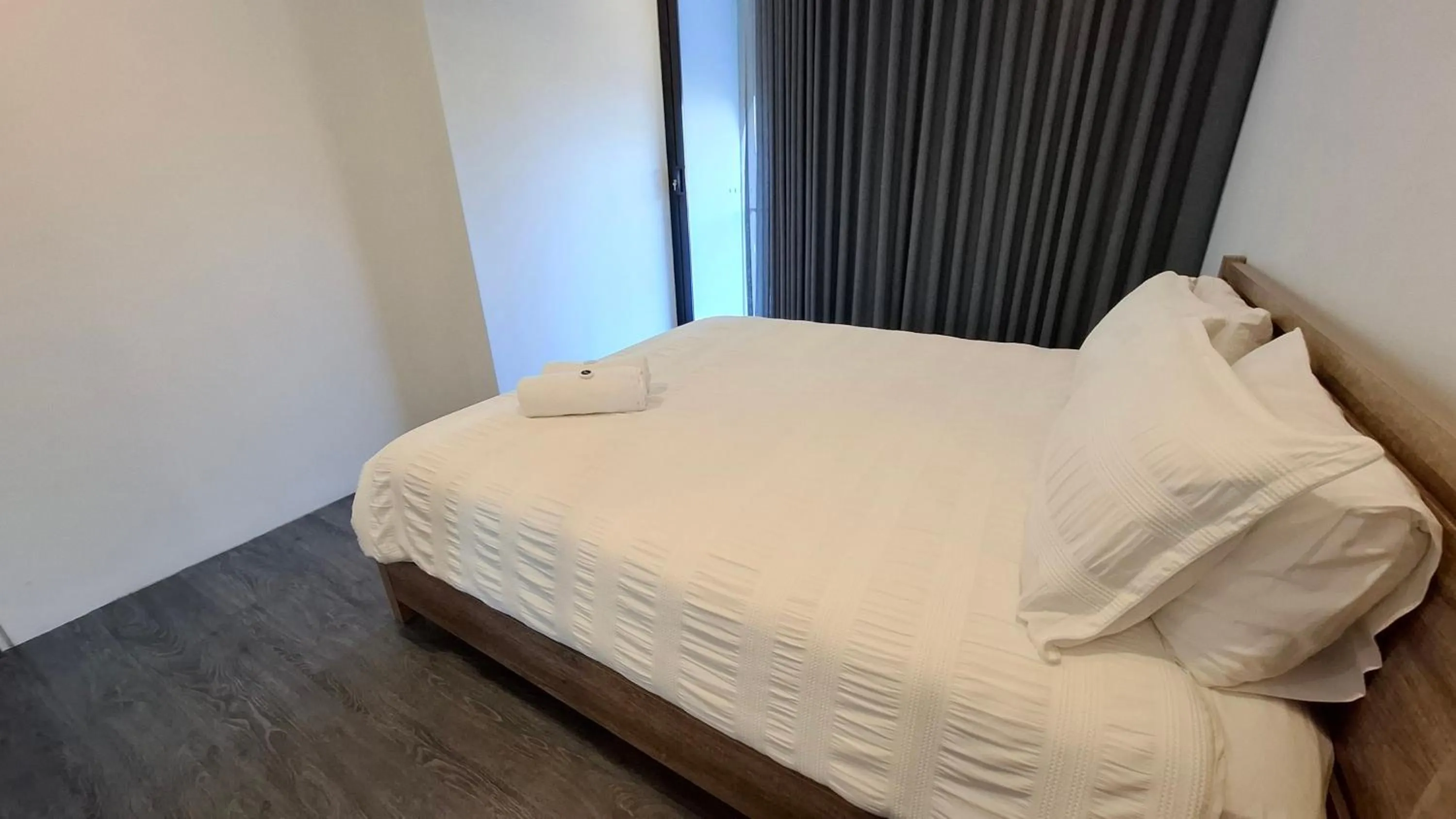 Bed in Exodus Dandenong Apartment Hotel