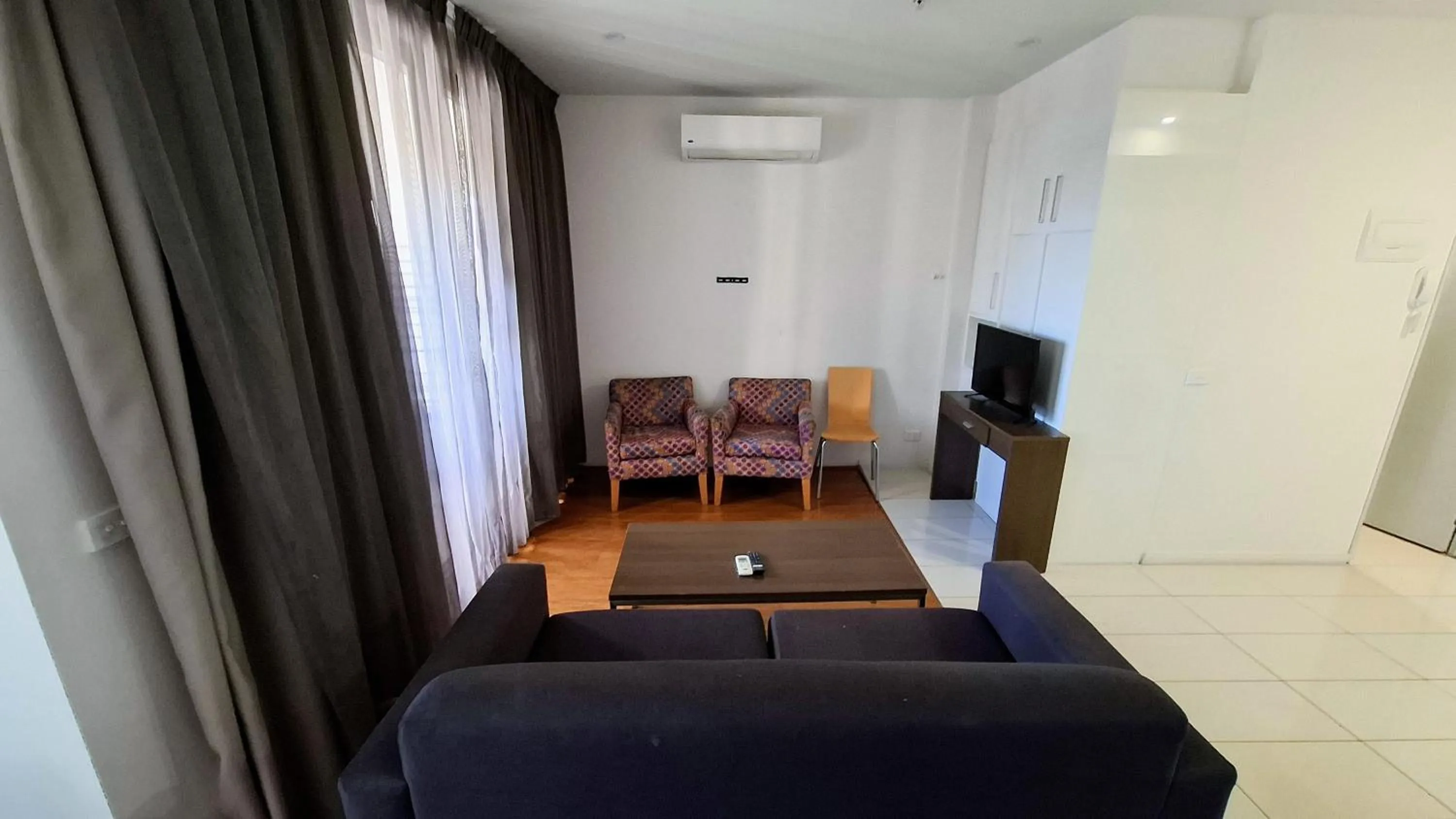 Seating area in Exodus Dandenong Apartment Hotel