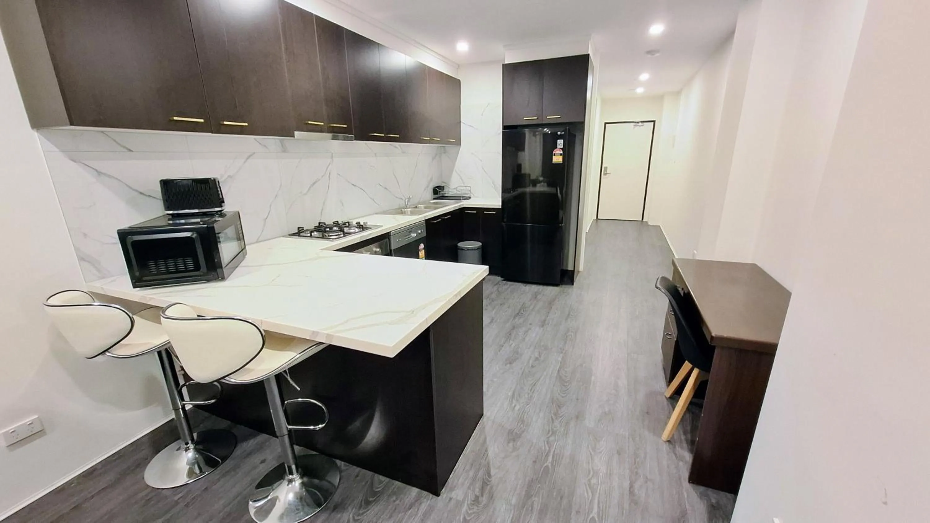 Kitchen or kitchenette in Exodus Dandenong Apartment Hotel