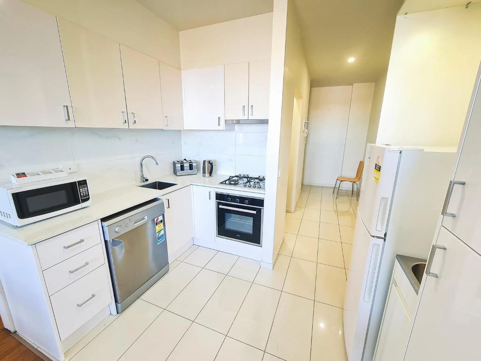 Kitchen or kitchenette in Exodus Dandenong Apartment Hotel