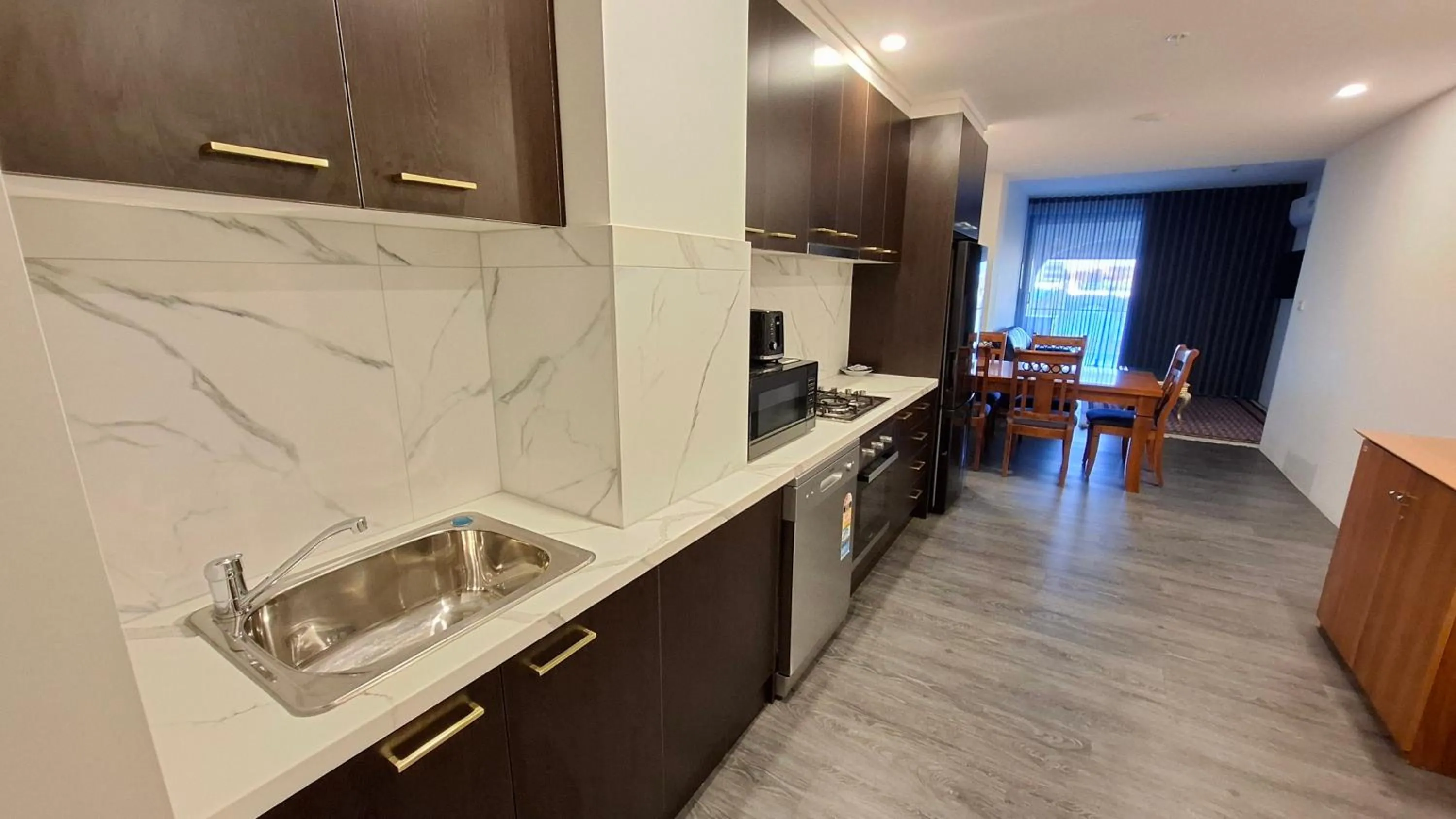 Kitchen or kitchenette in Exodus Dandenong Apartment Hotel