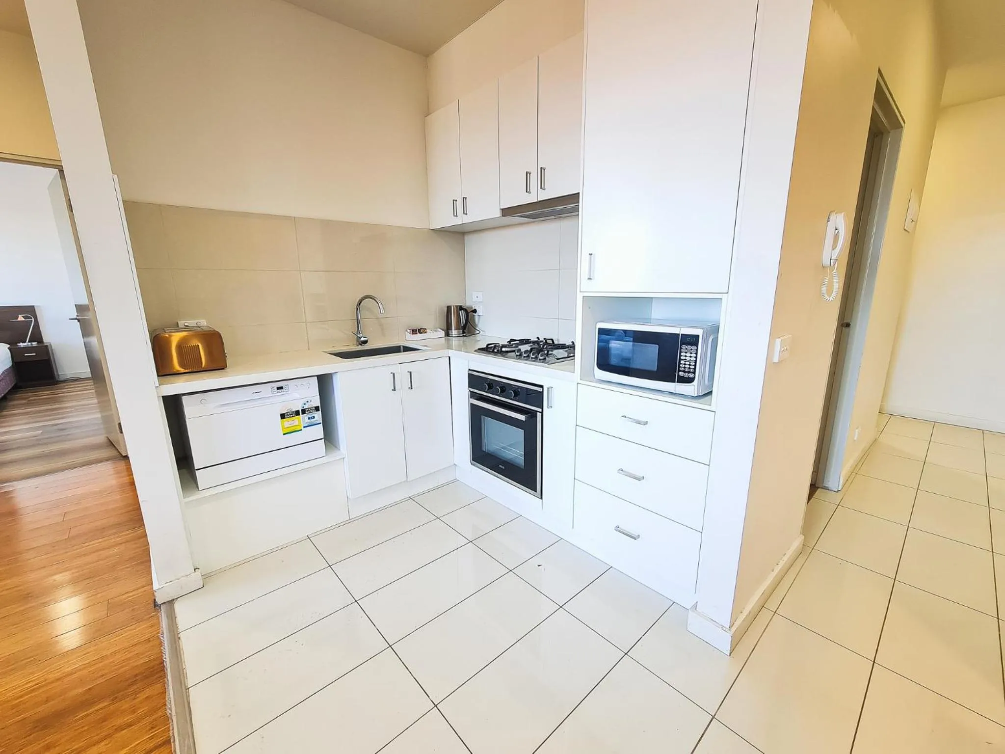 Kitchen or kitchenette in Exodus Dandenong Apartment Hotel