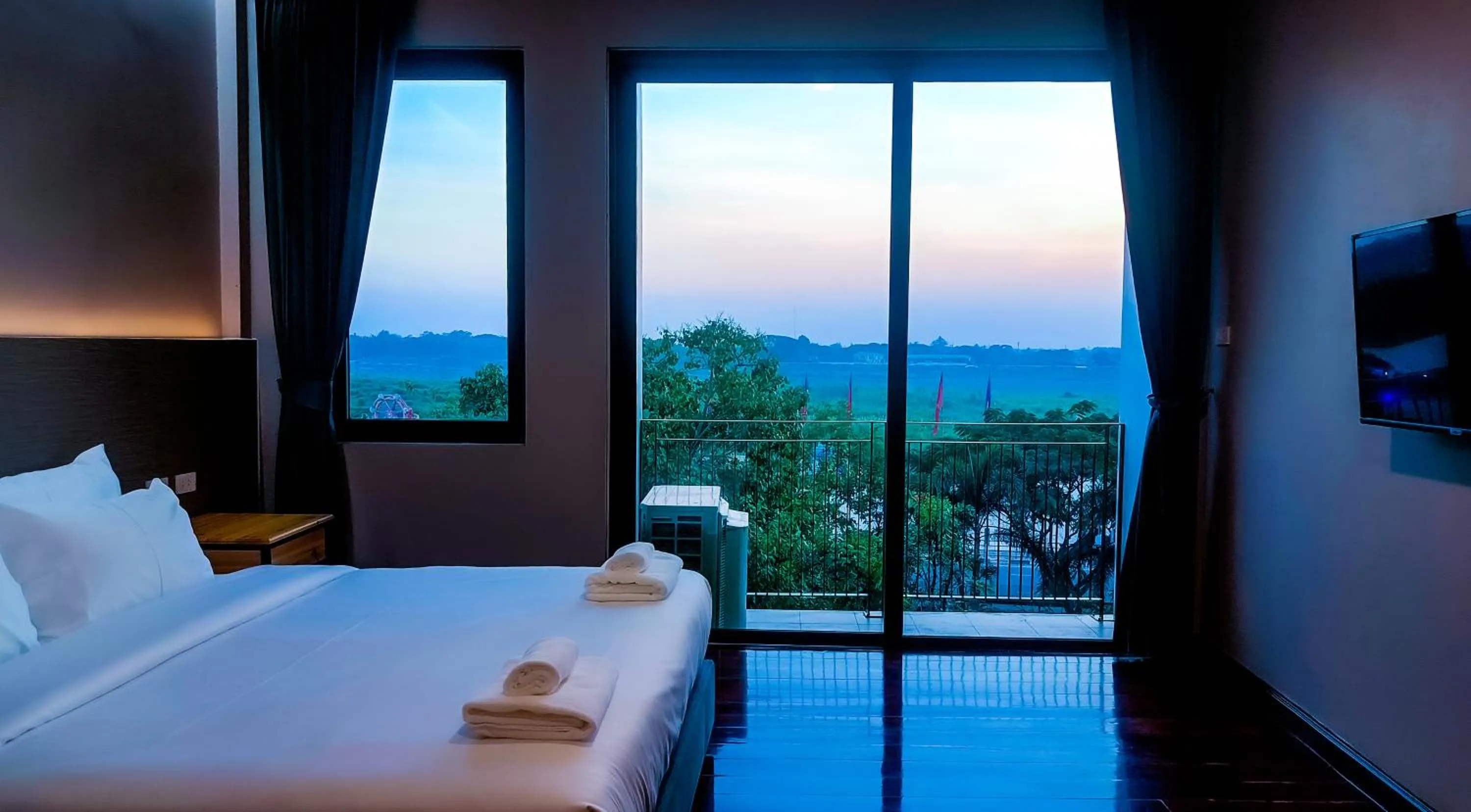 Bed in The Riva Vientiane Hotel