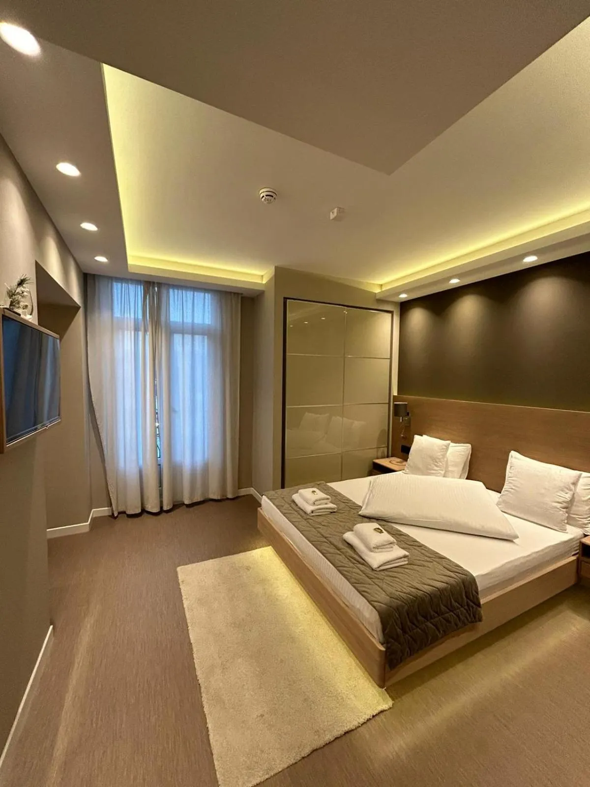 Bed in Emilia Lux Rooms