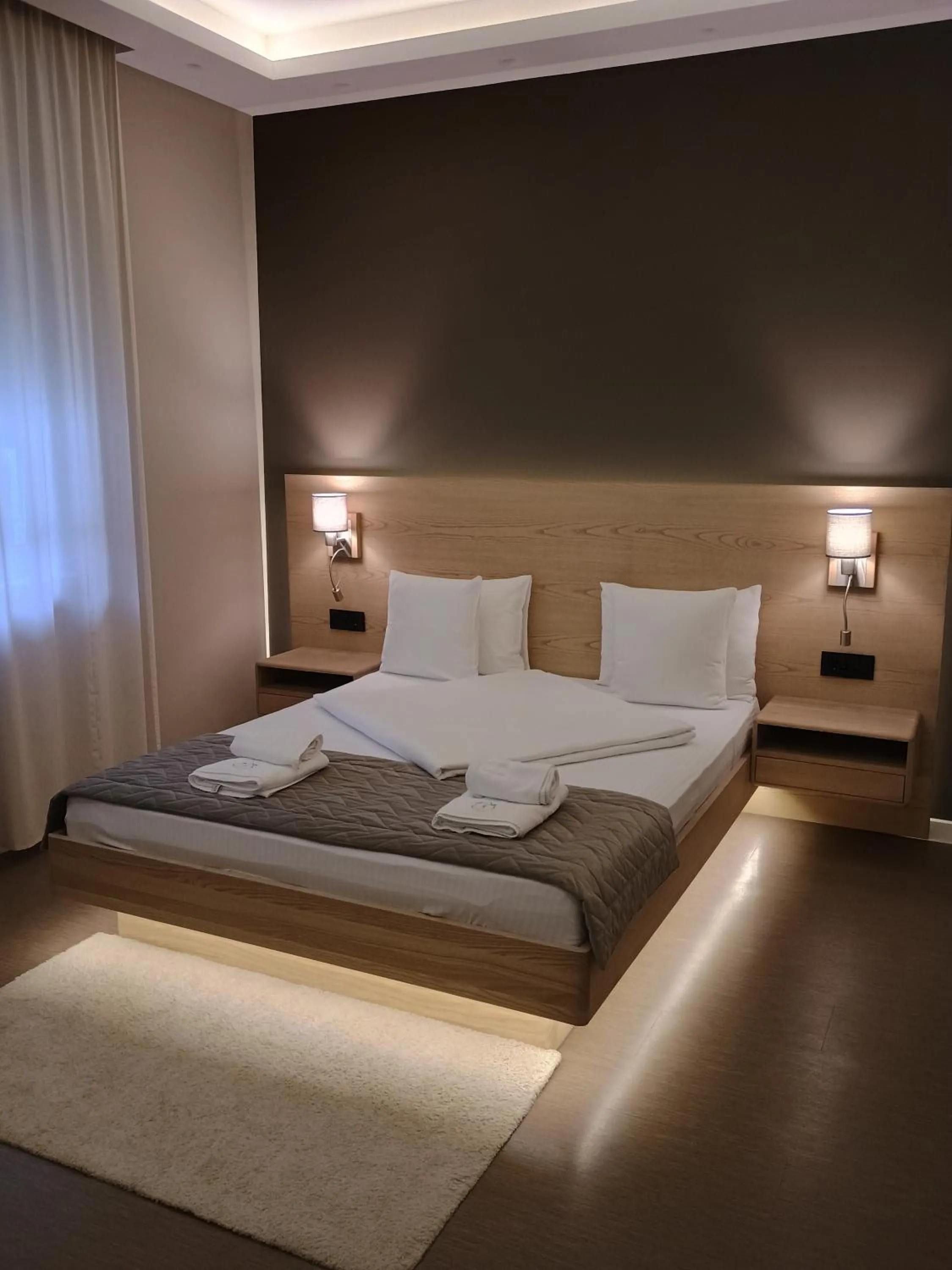 Bed in Emilia Lux Rooms