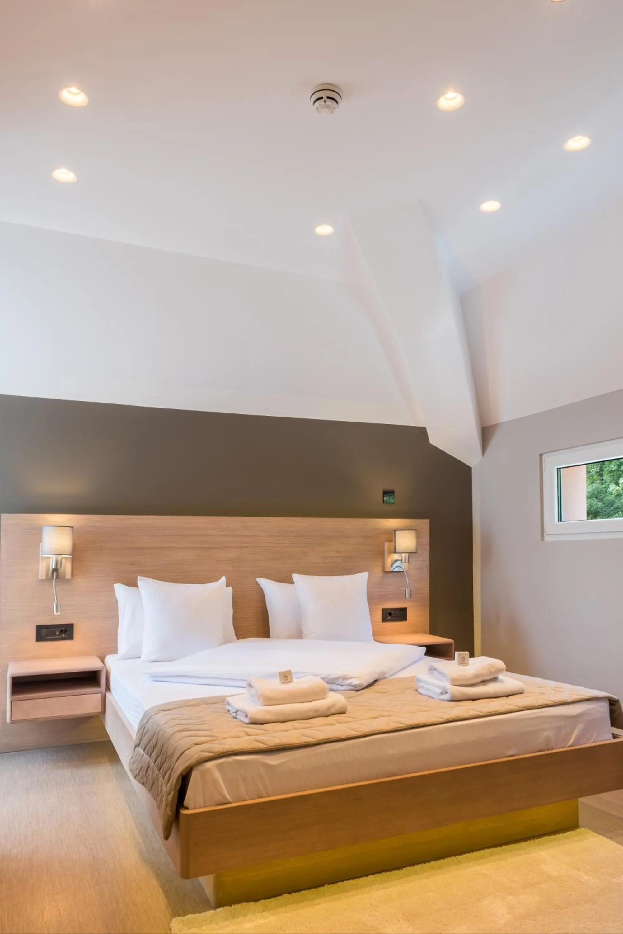 Bed in Emilia Lux Rooms