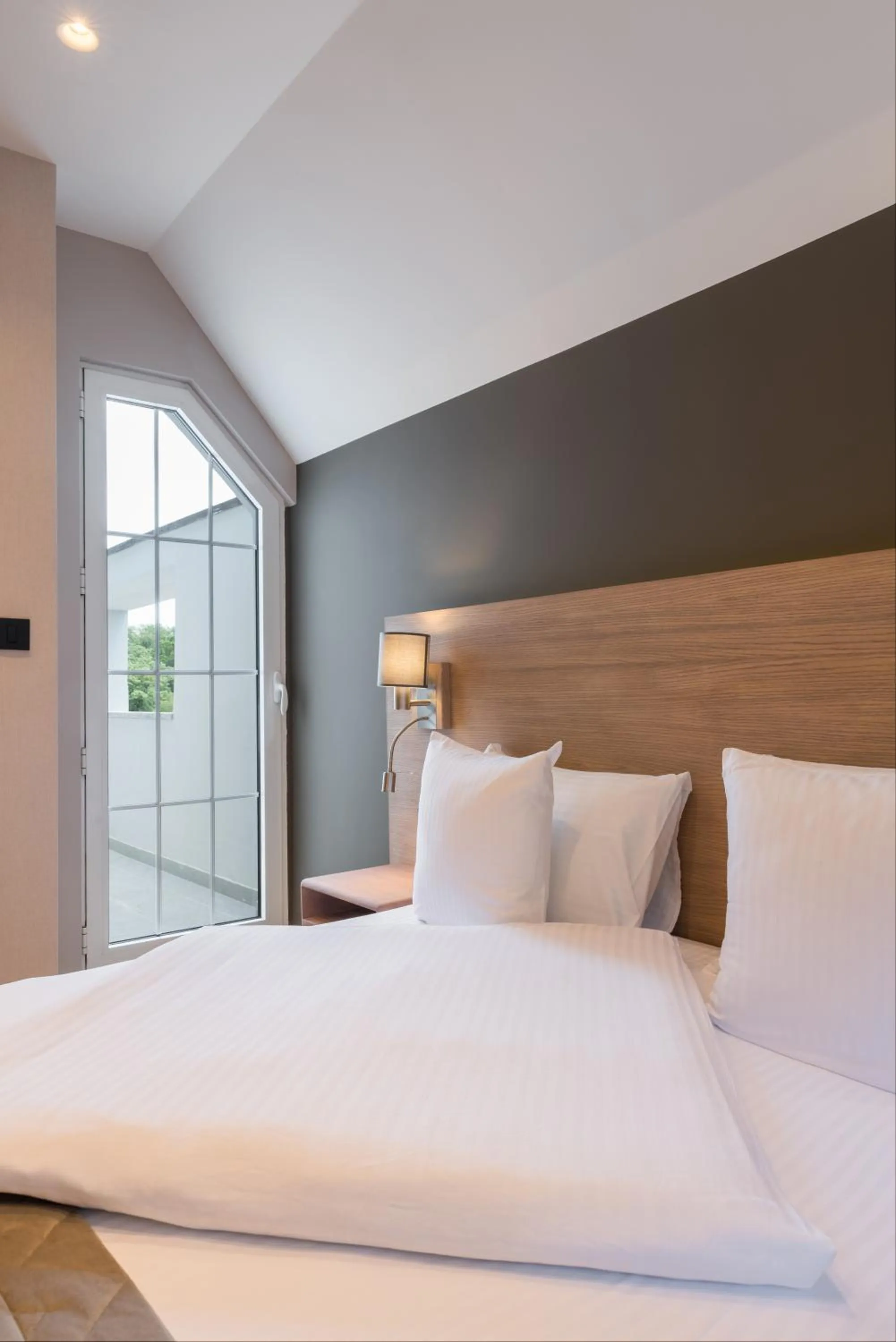 Bed in Emilia Lux Rooms