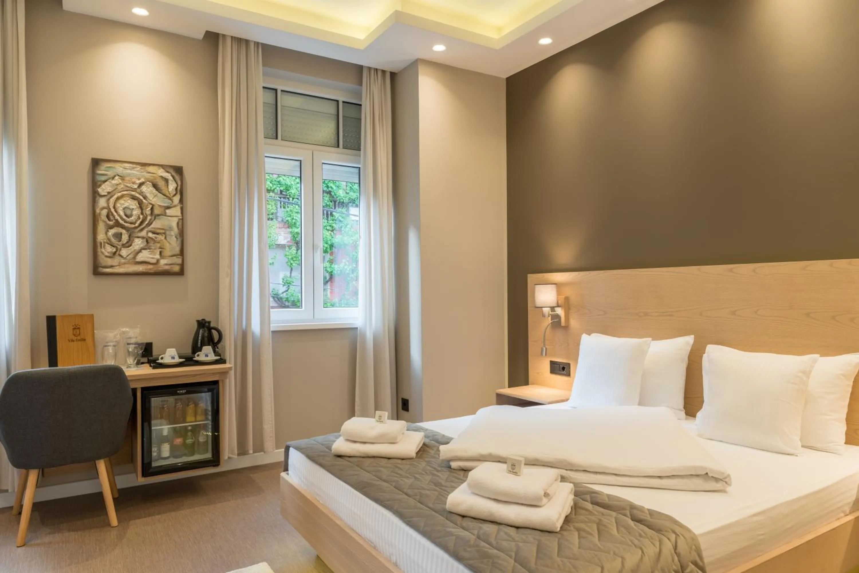 Bed in Emilia Lux Rooms