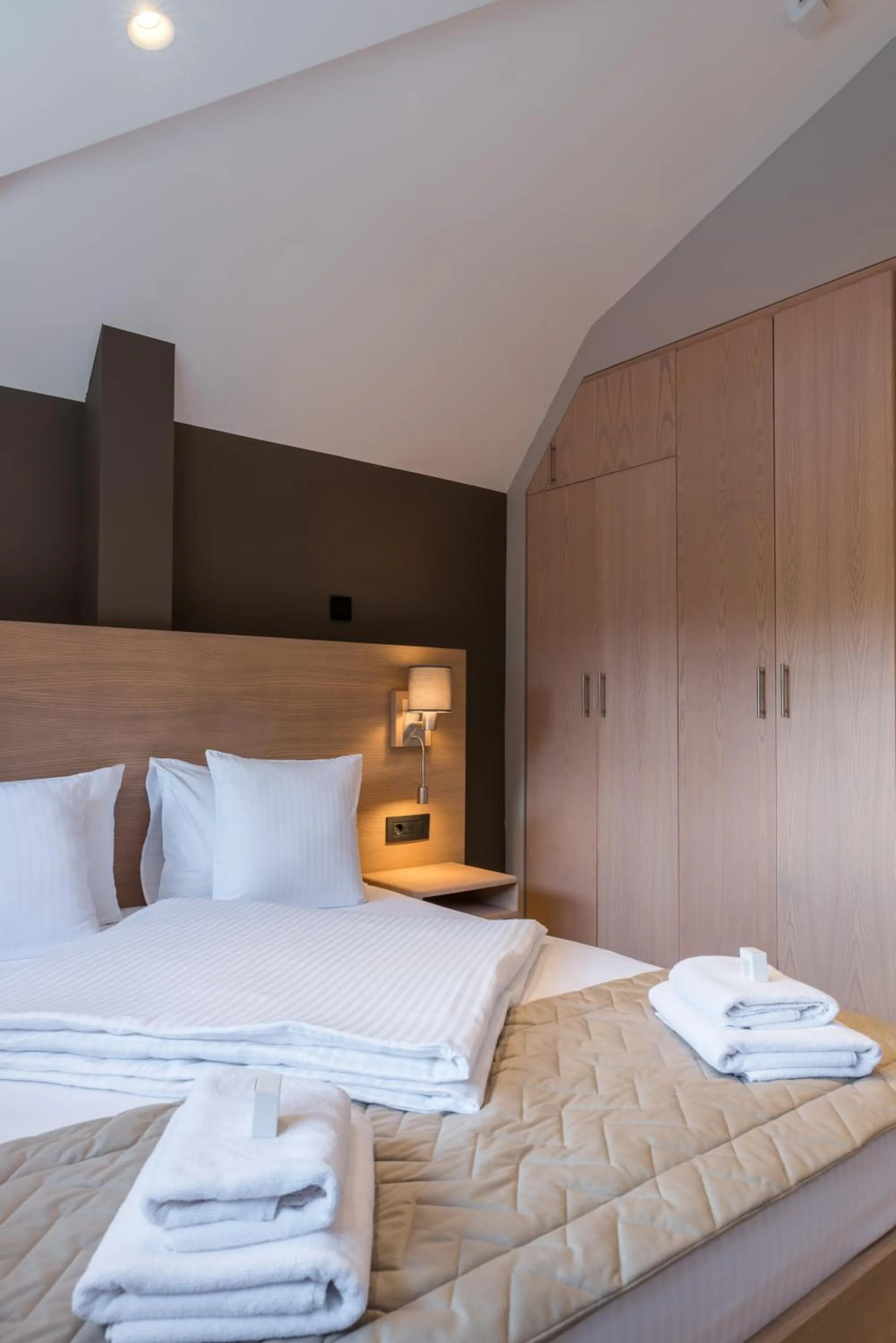 Bed in Emilia Lux Rooms