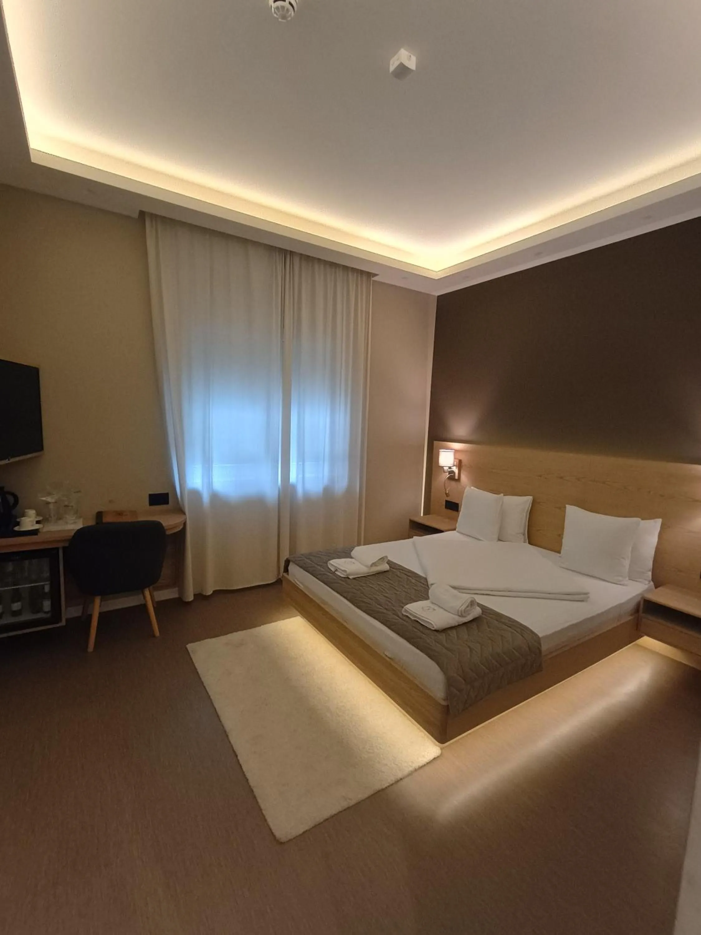 Bed in Emilia Lux Rooms