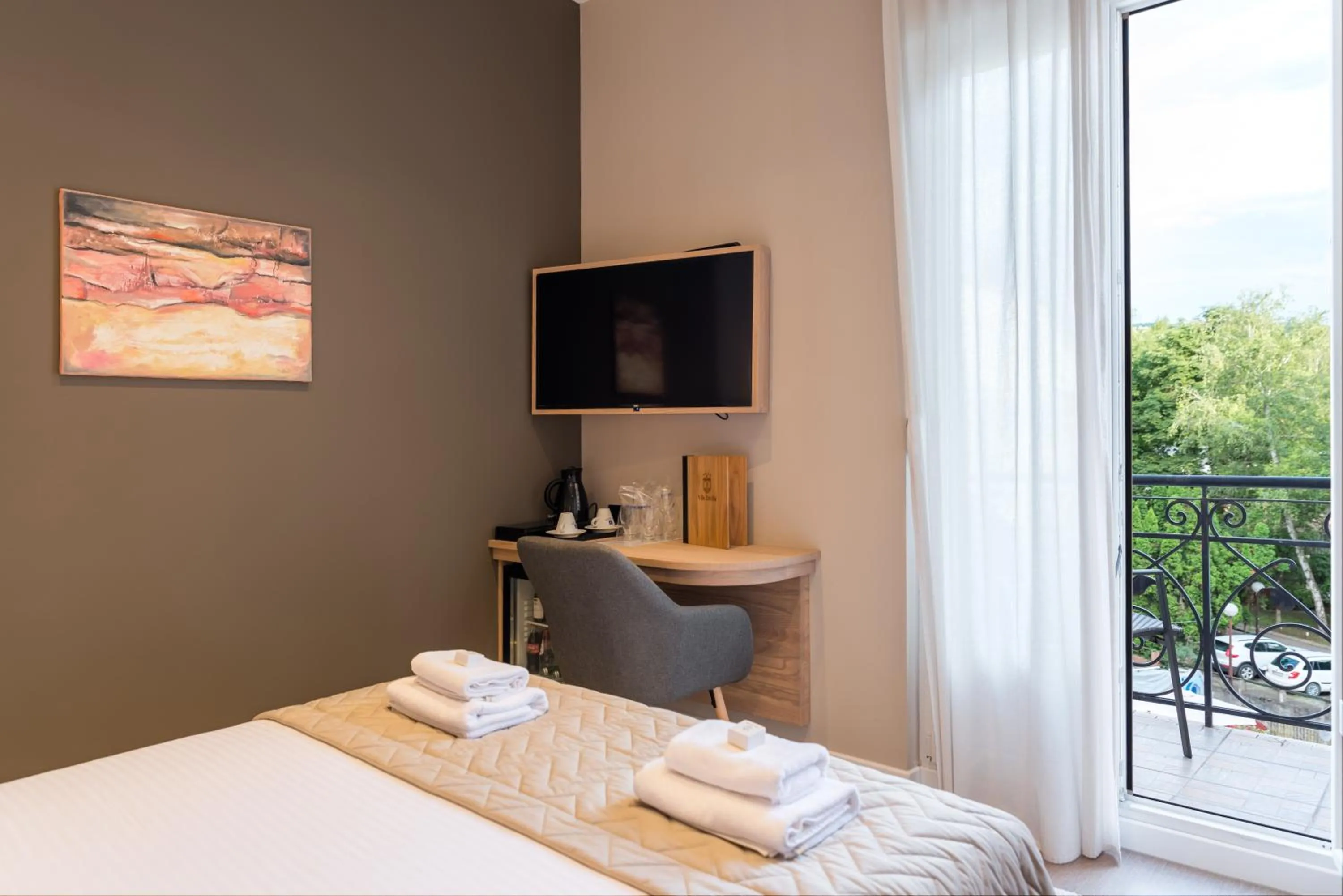 Bed in Emilia Lux Rooms