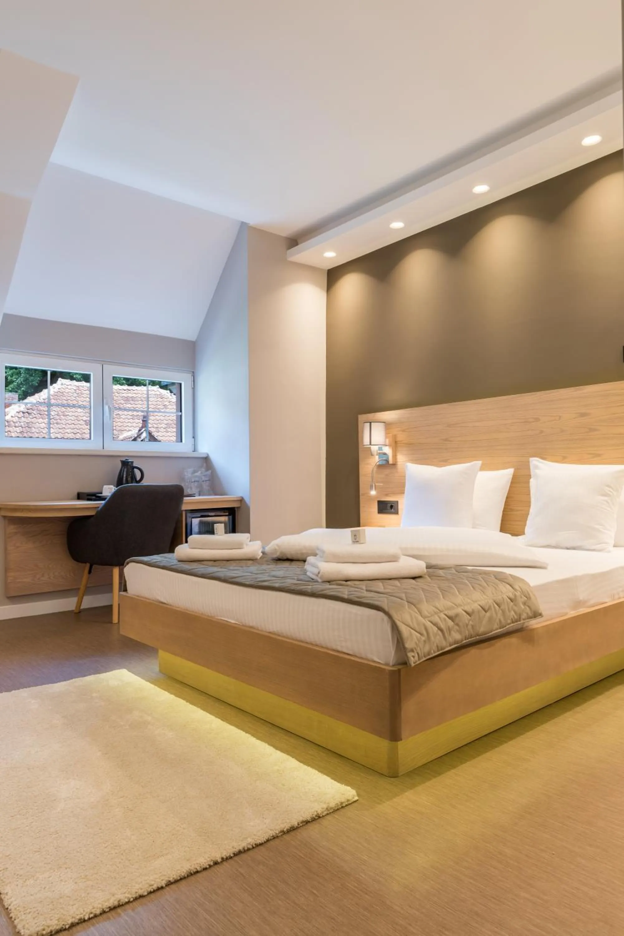 Bed in Emilia Lux Rooms