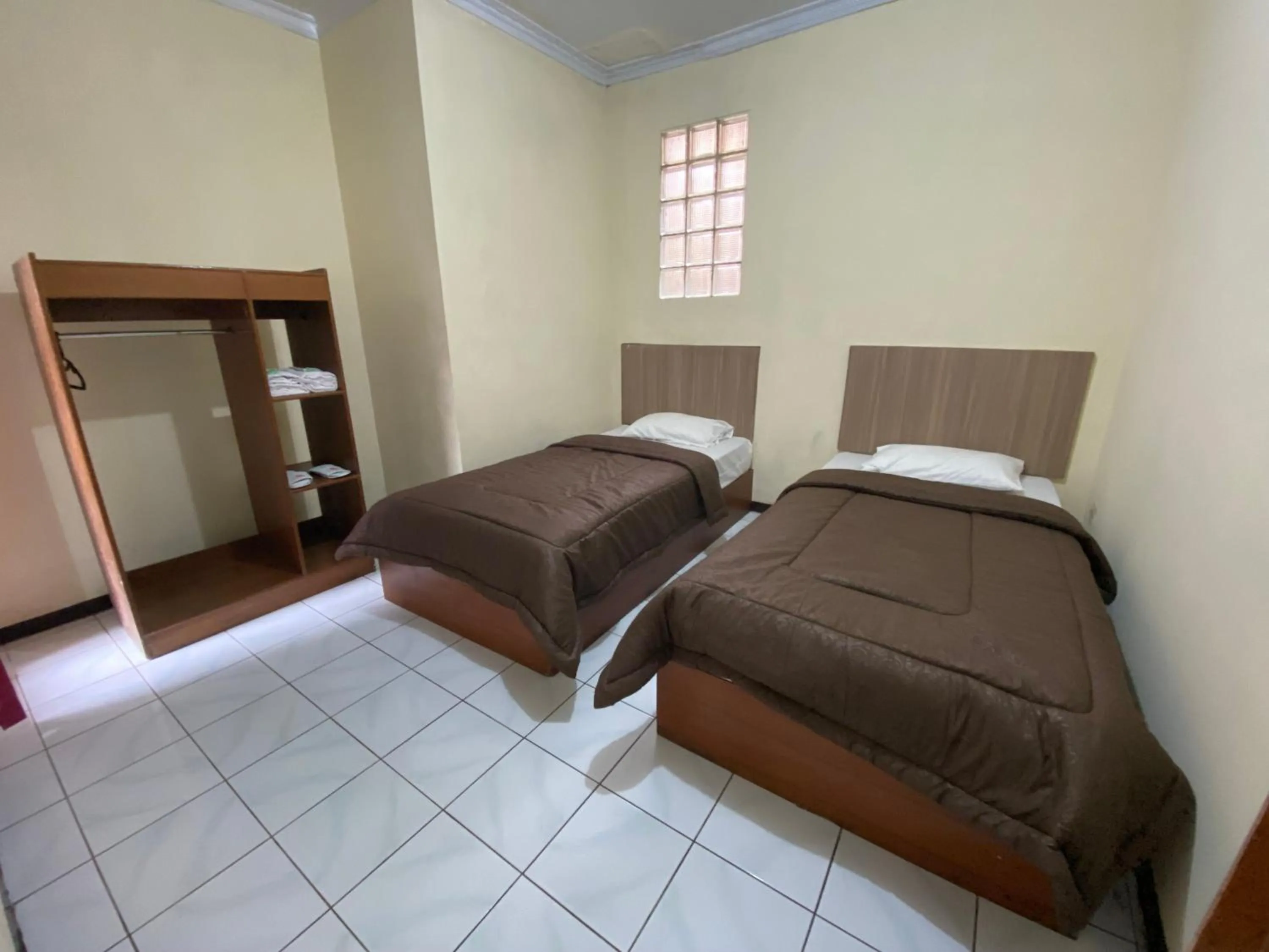 Bed in Hotel Puspa Sari