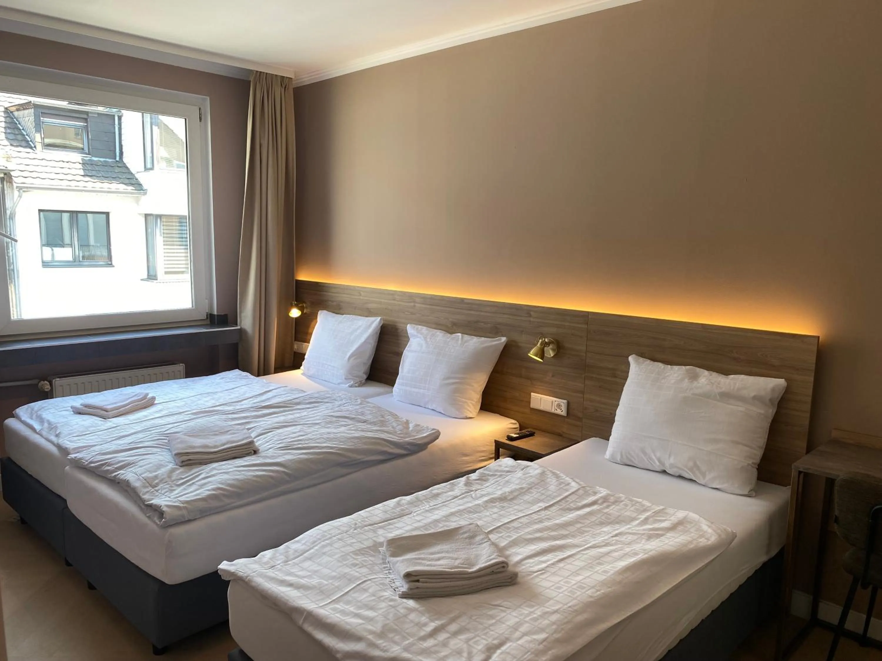 Bed in Hotel Petite Königsallee SELF CHECK-IN