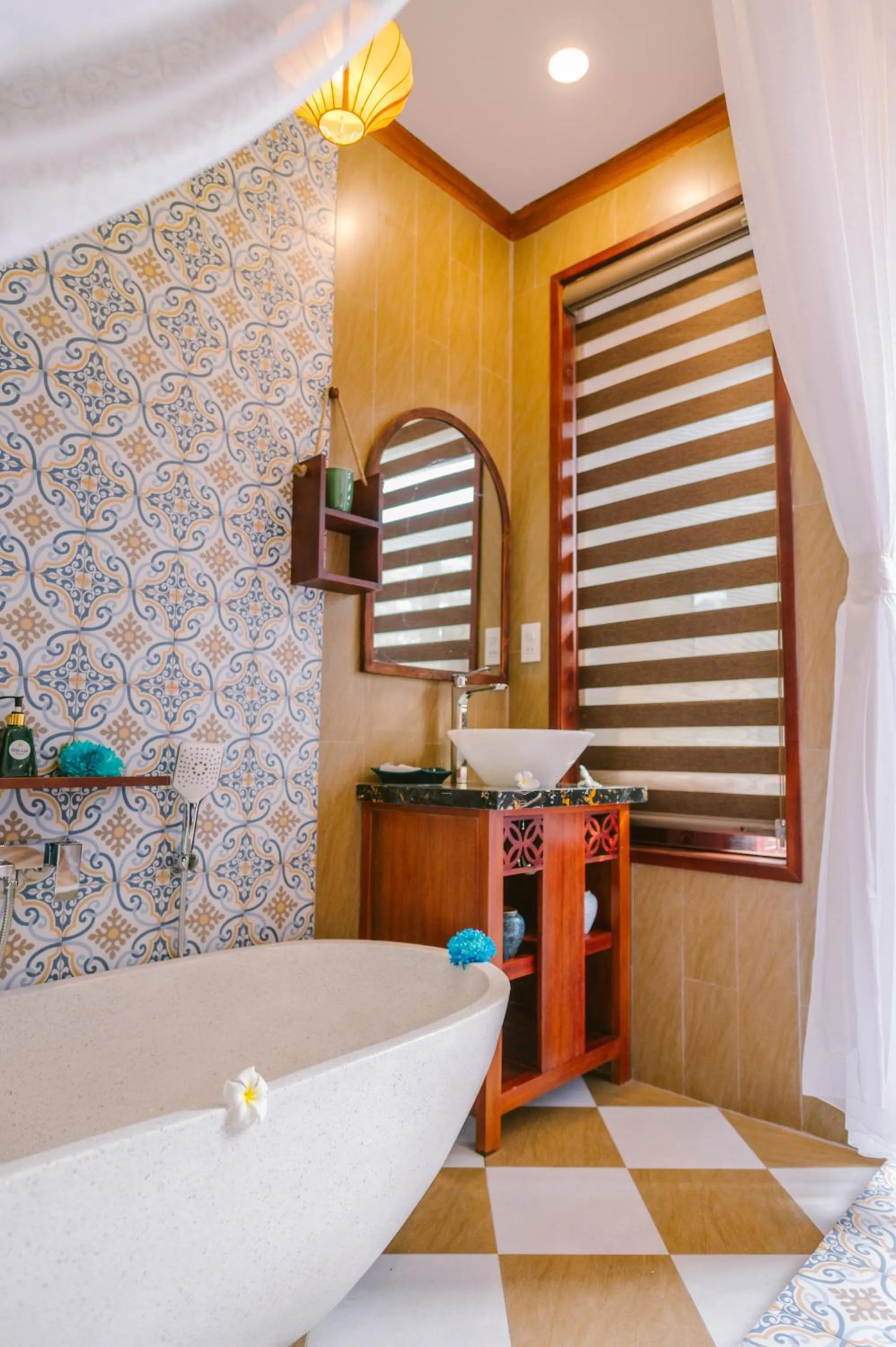 Bathroom in De'Colore Villa Hoi An