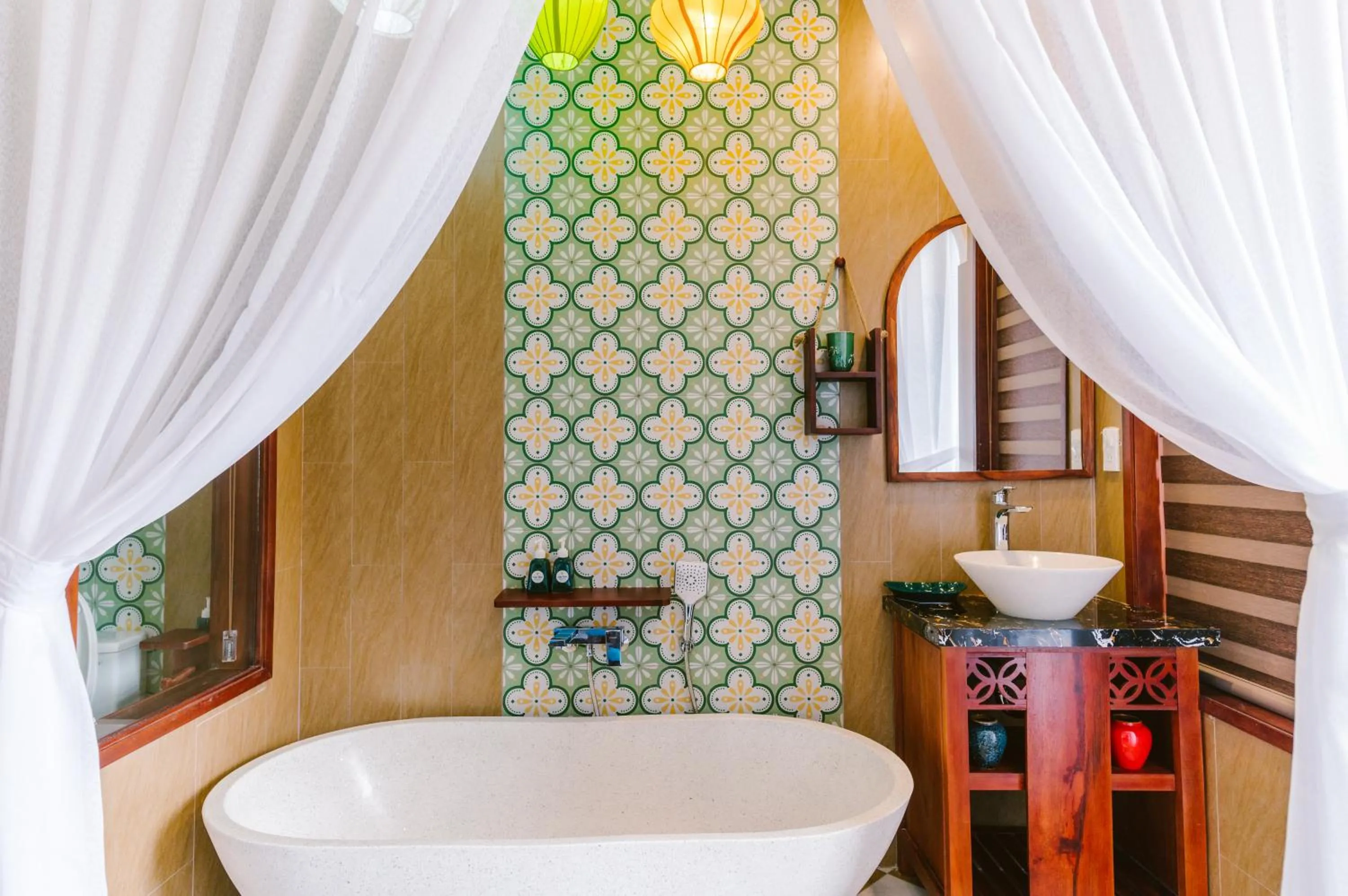 Bathroom in De'Colore Villa Hoi An