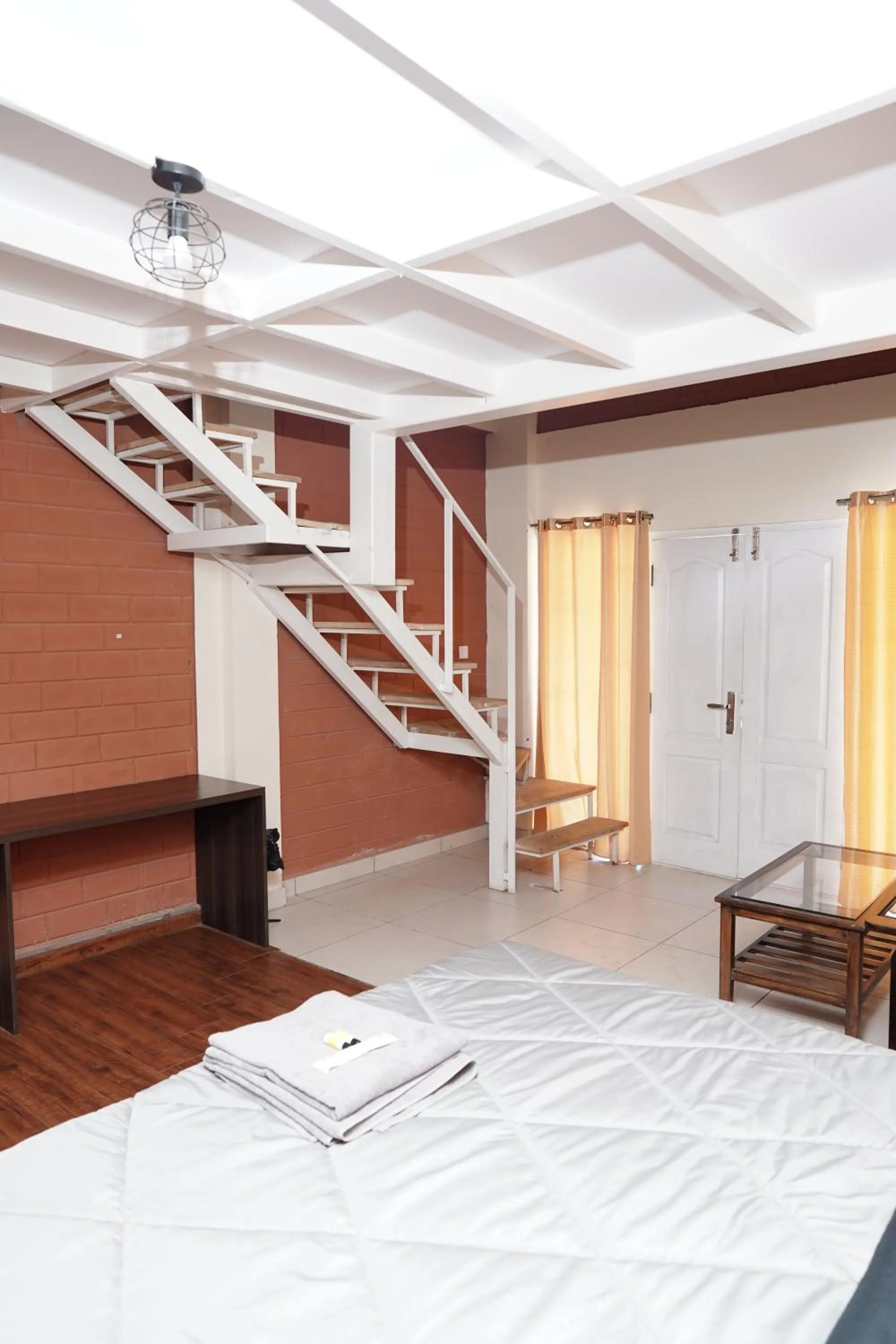 Bed in Tea Leaf Stays by Brown Tree Resorts