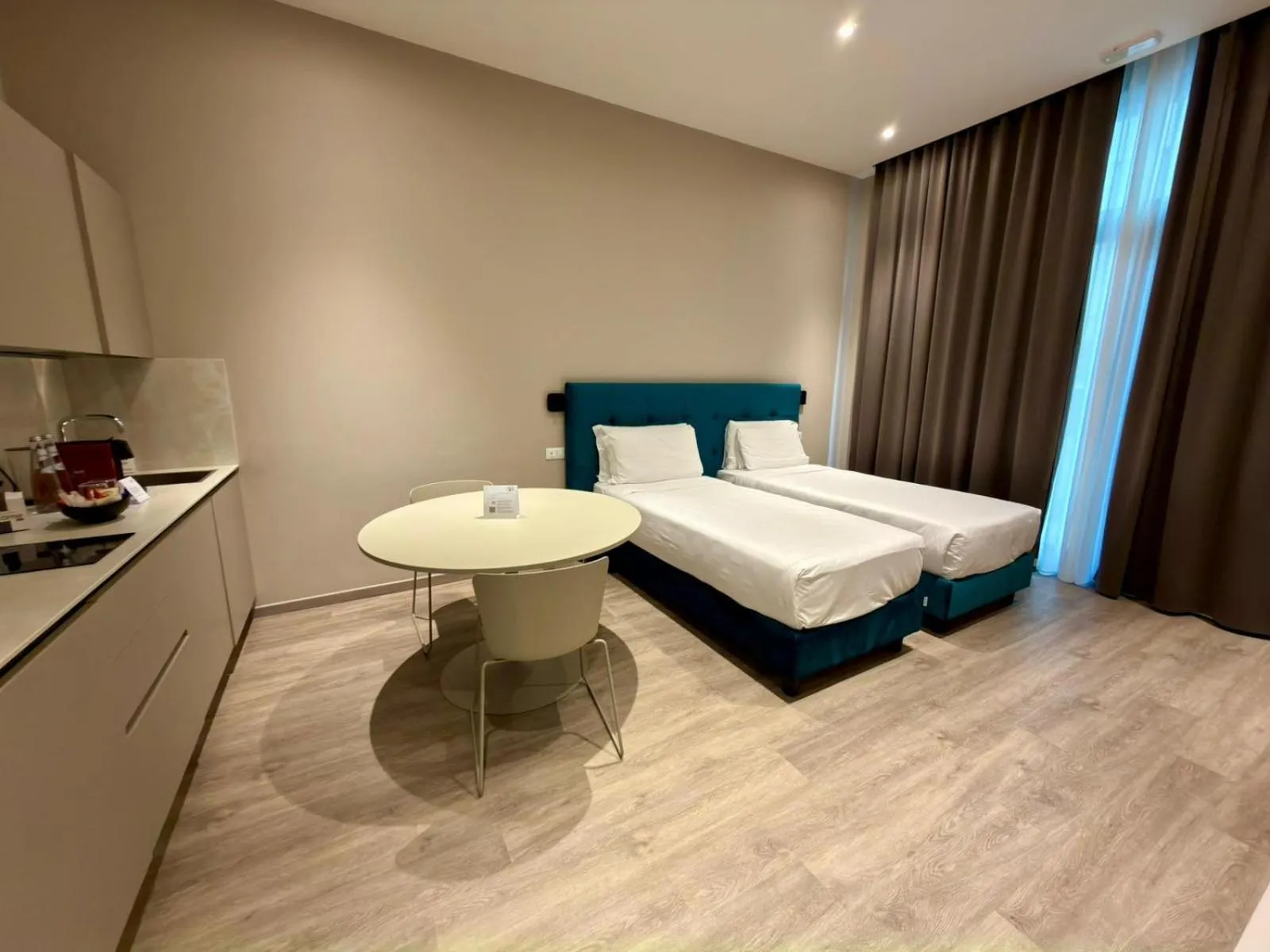 Kitchen or kitchenette, Bed in Vi Suites