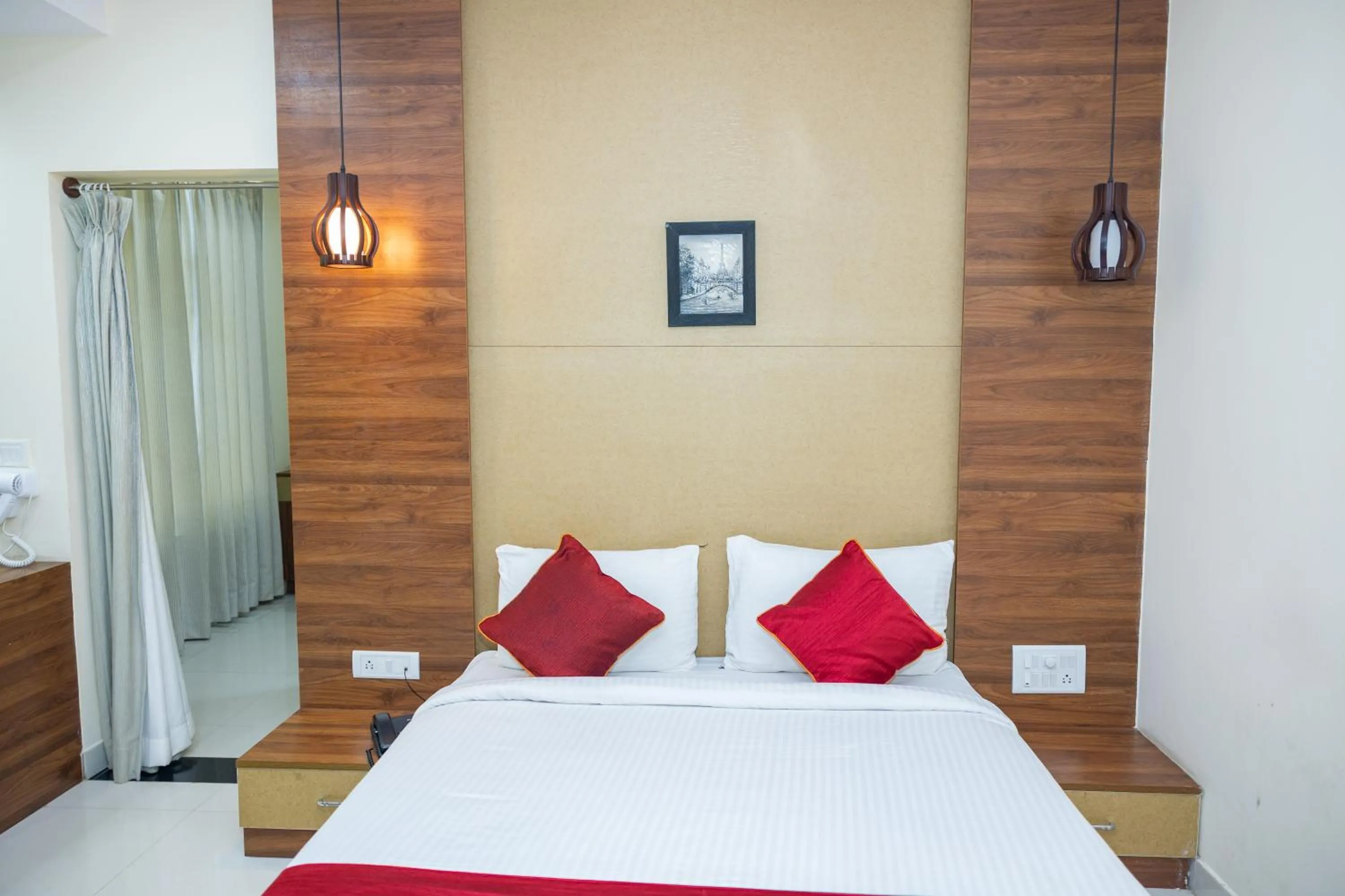 Bed in Ishwerya Suites