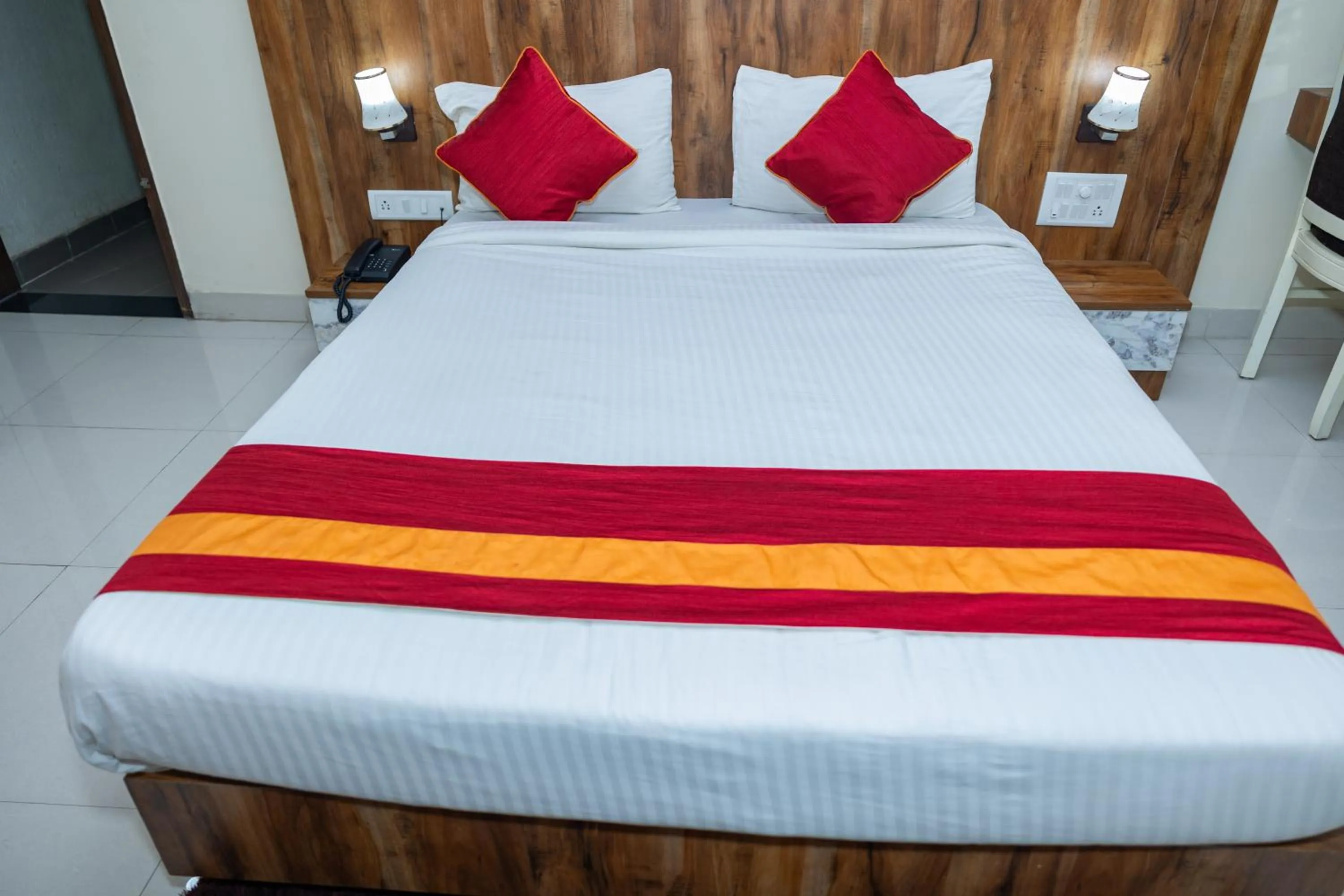Bed in Ishwerya Suites