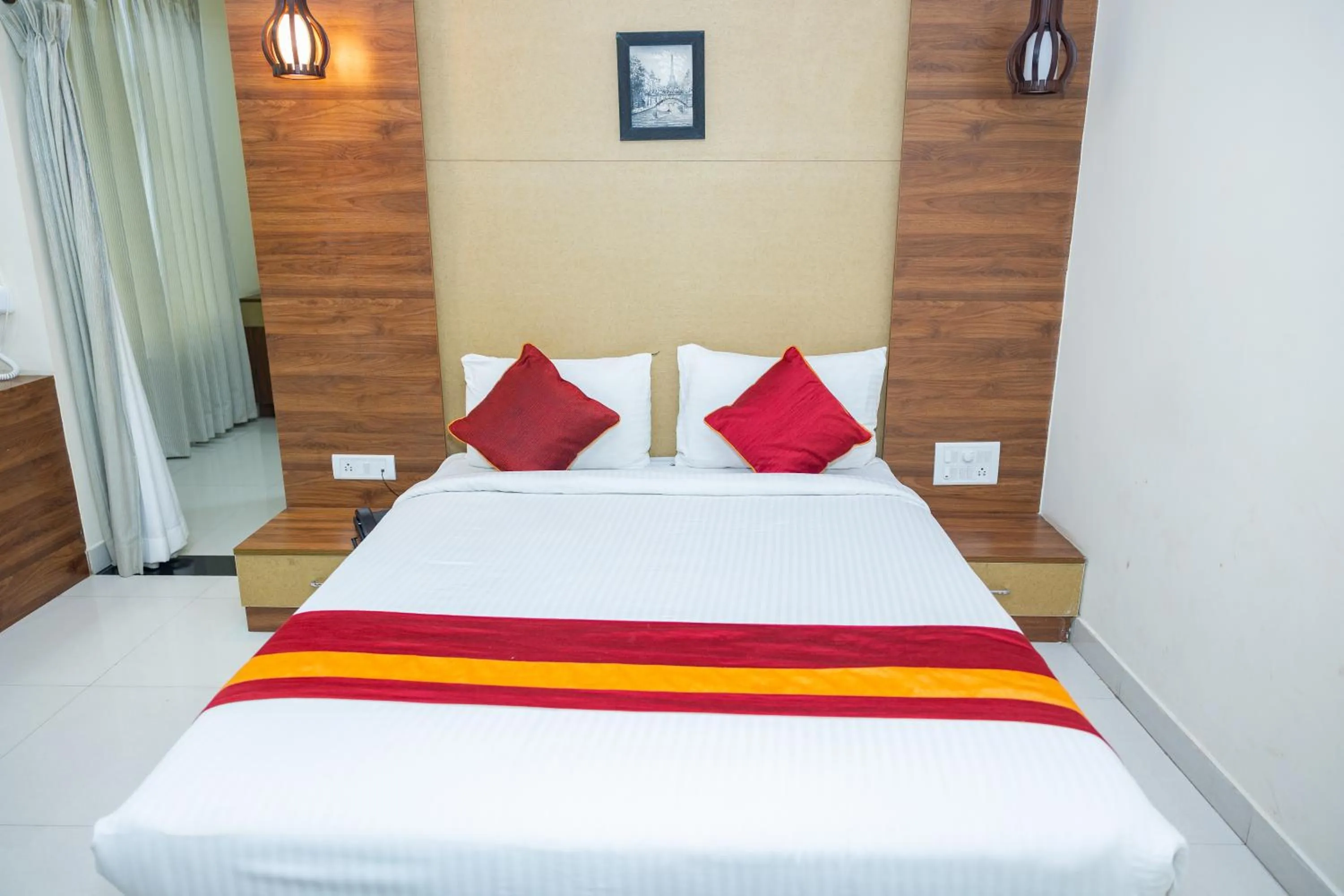 Bed in Ishwerya Suites