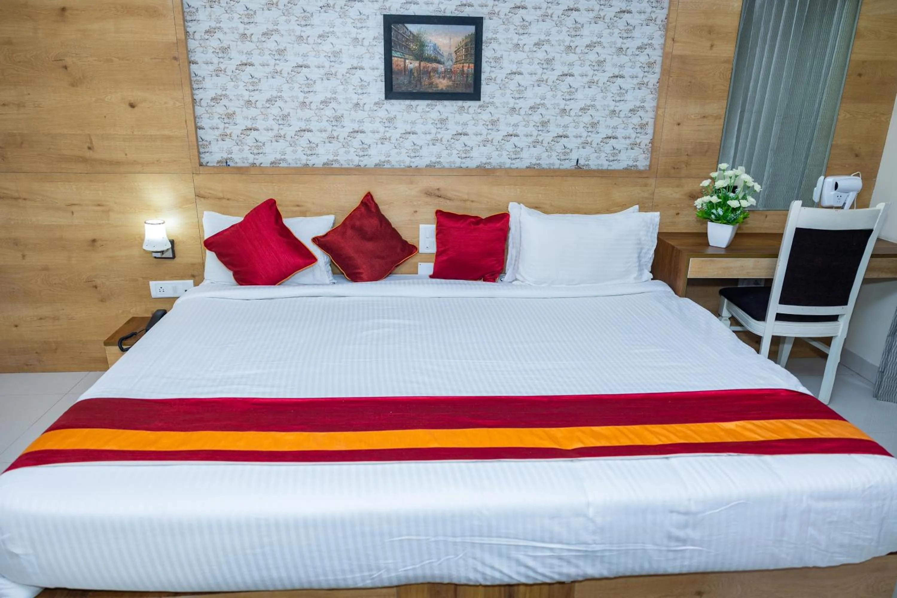 Bed in Ishwerya Suites