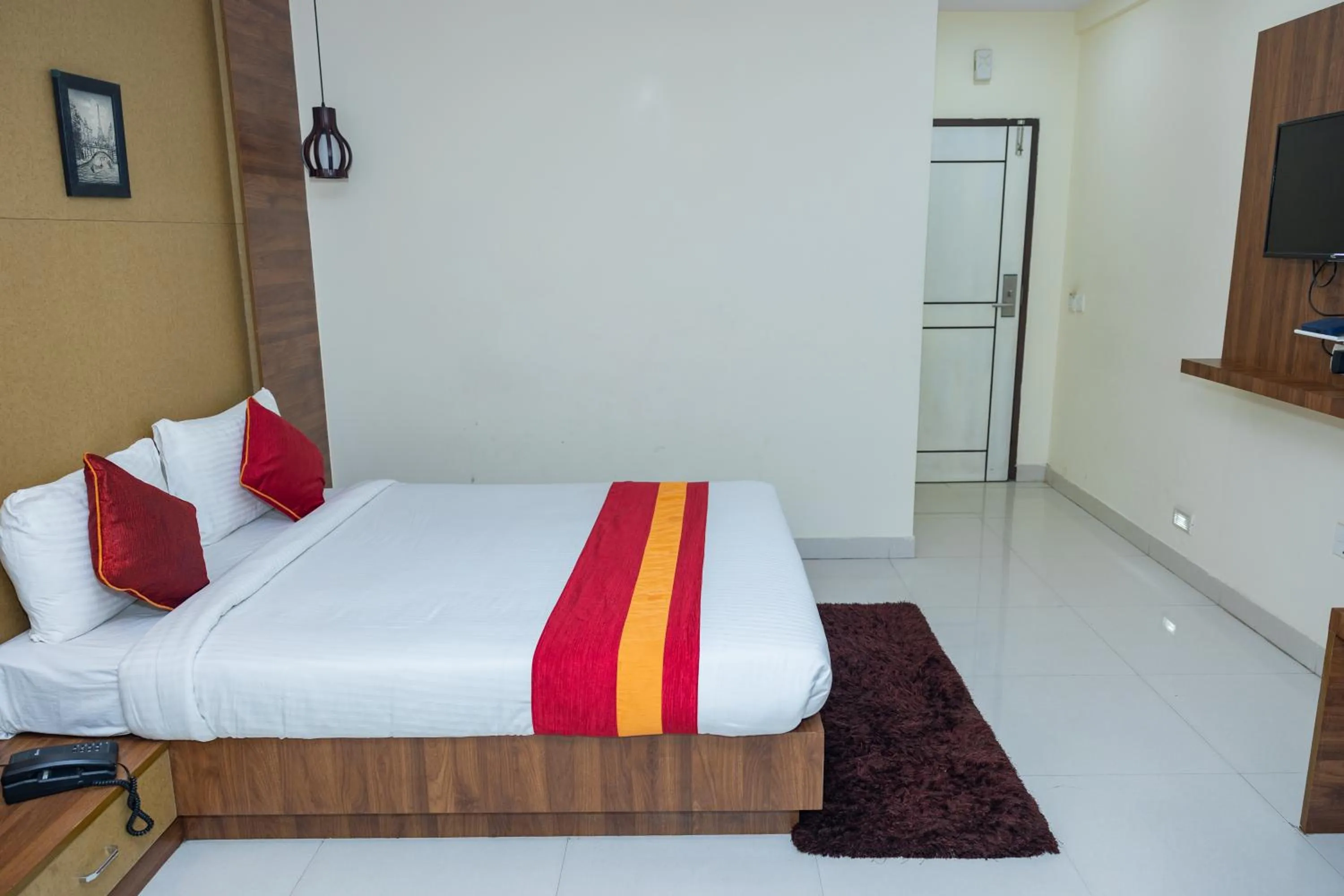 Bed in Ishwerya Suites