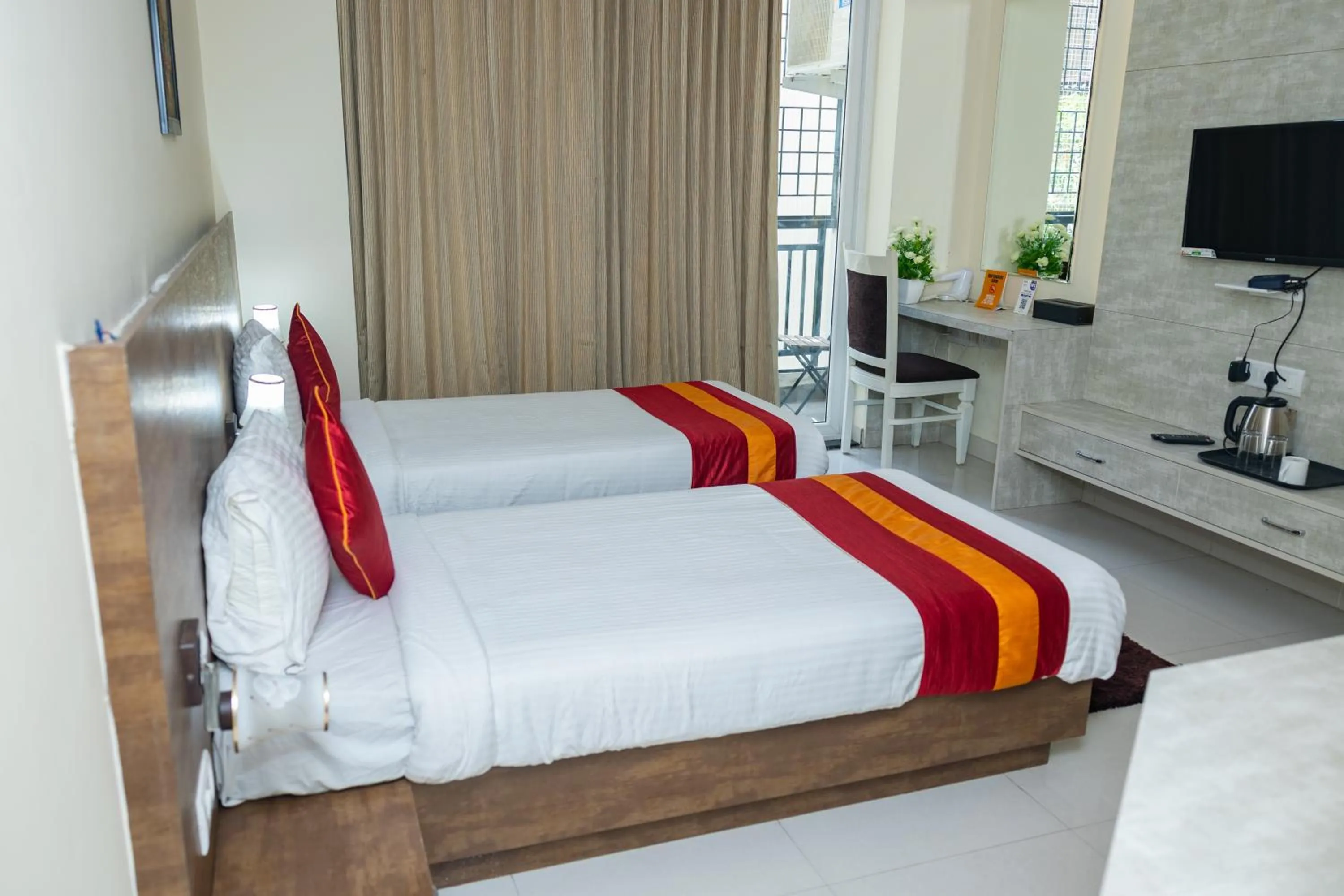 Bed in Ishwerya Suites
