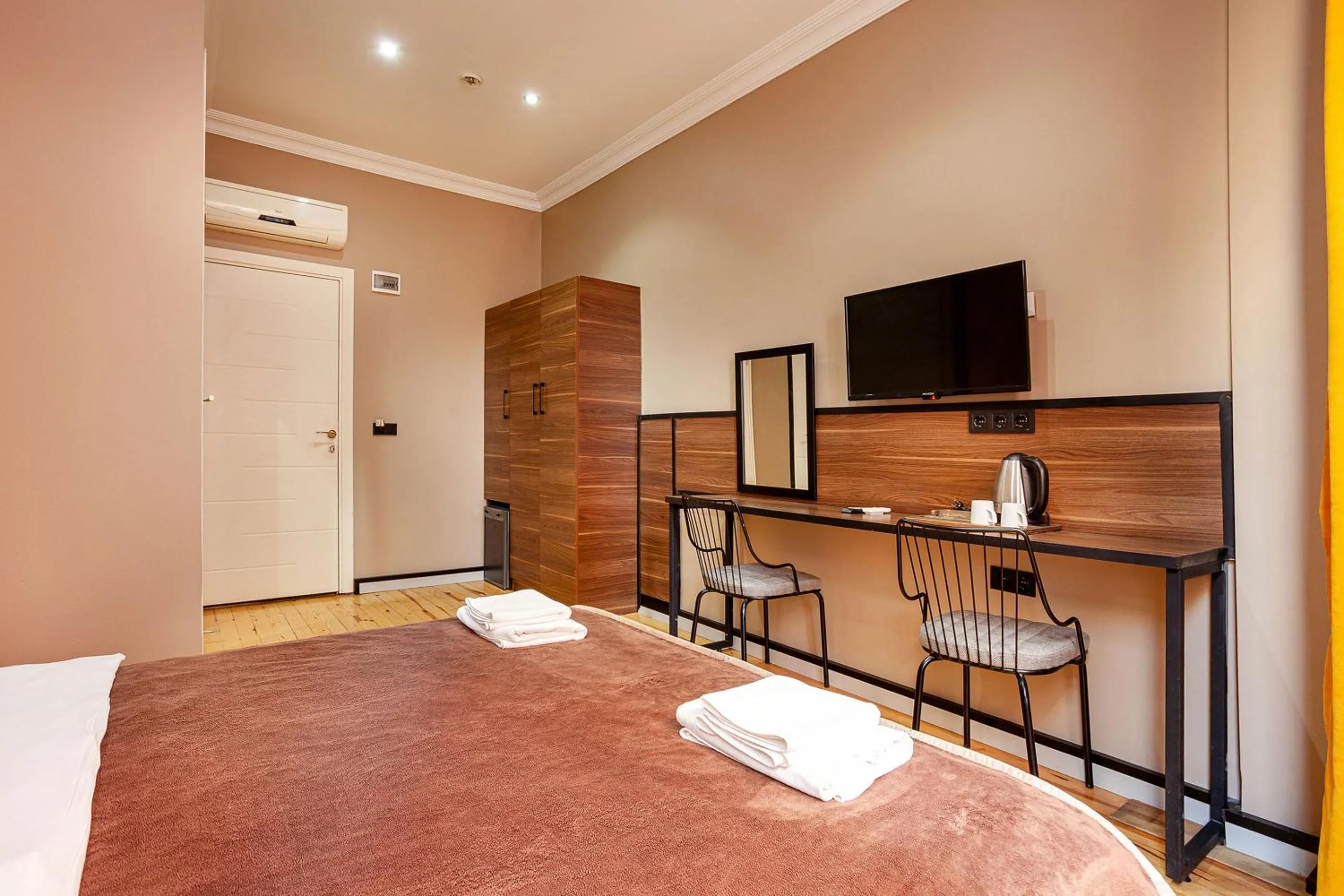 Bed in Aram Kerasi Rooms