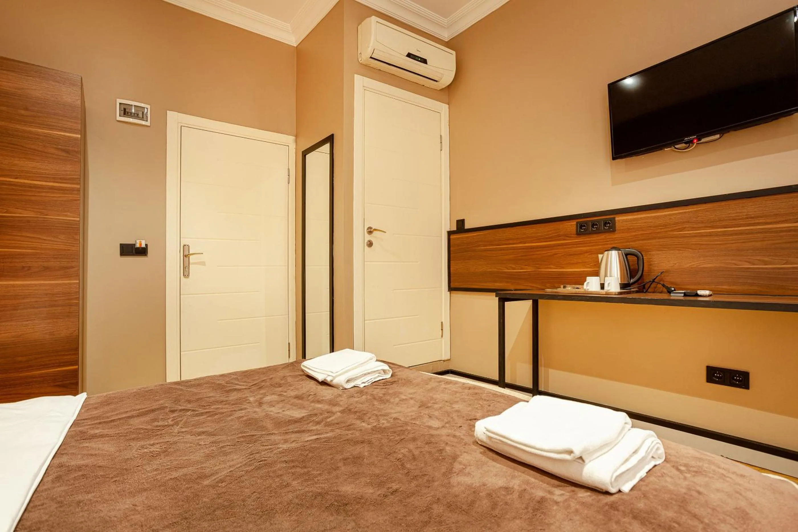 Bed in Aram Kerasi Rooms