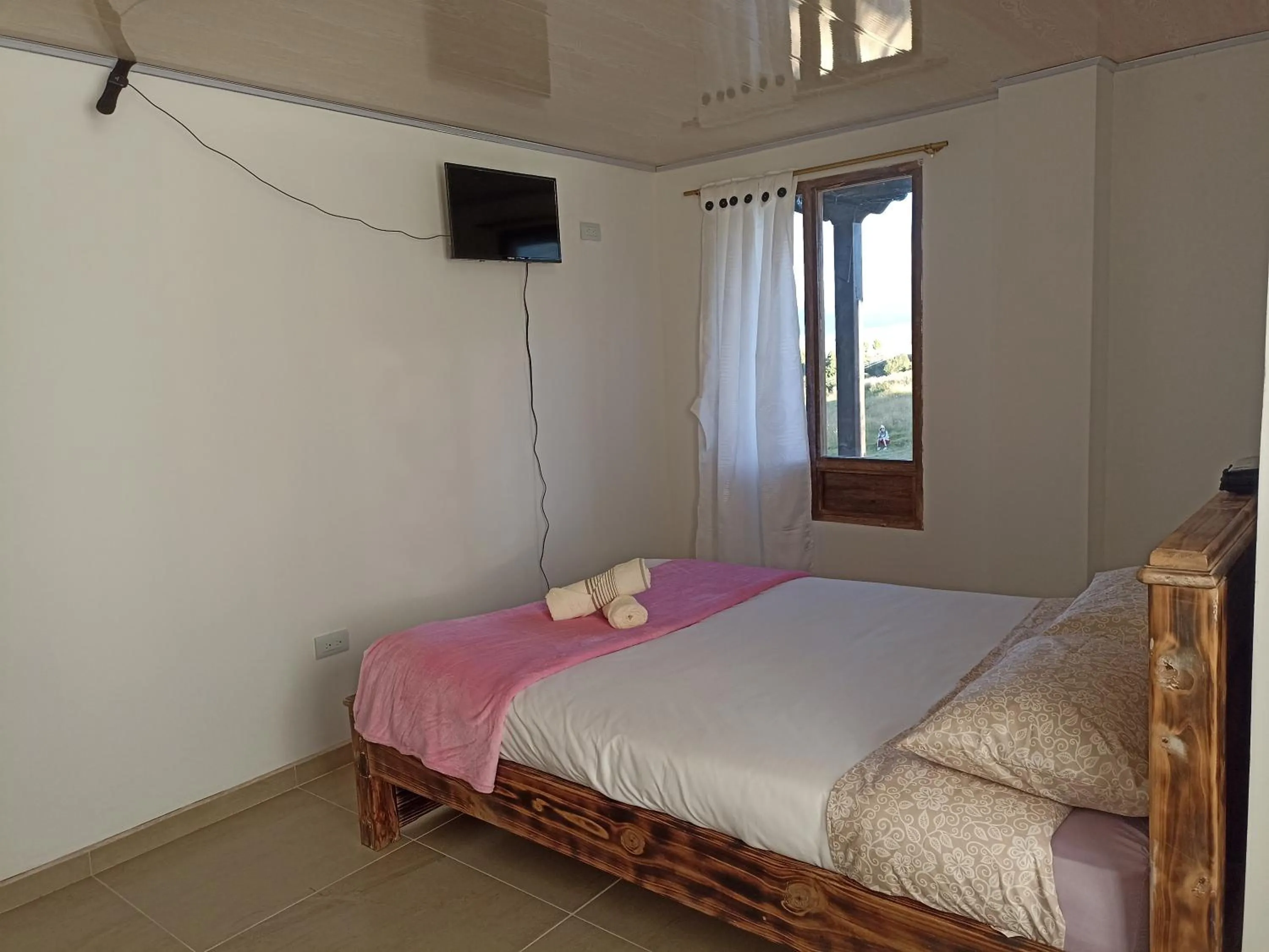 Bed in HOTEL TOTA ELISEO PLAYA BLANCA LAGO DE TOTA