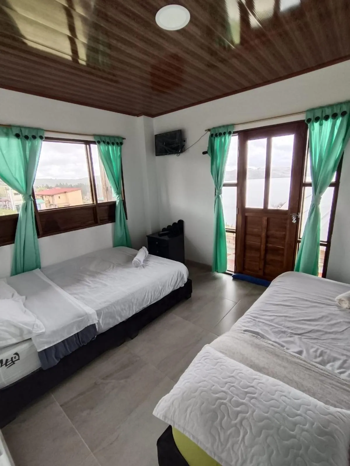 Bed in HOTEL TOTA ELISEO PLAYA BLANCA LAGO DE TOTA