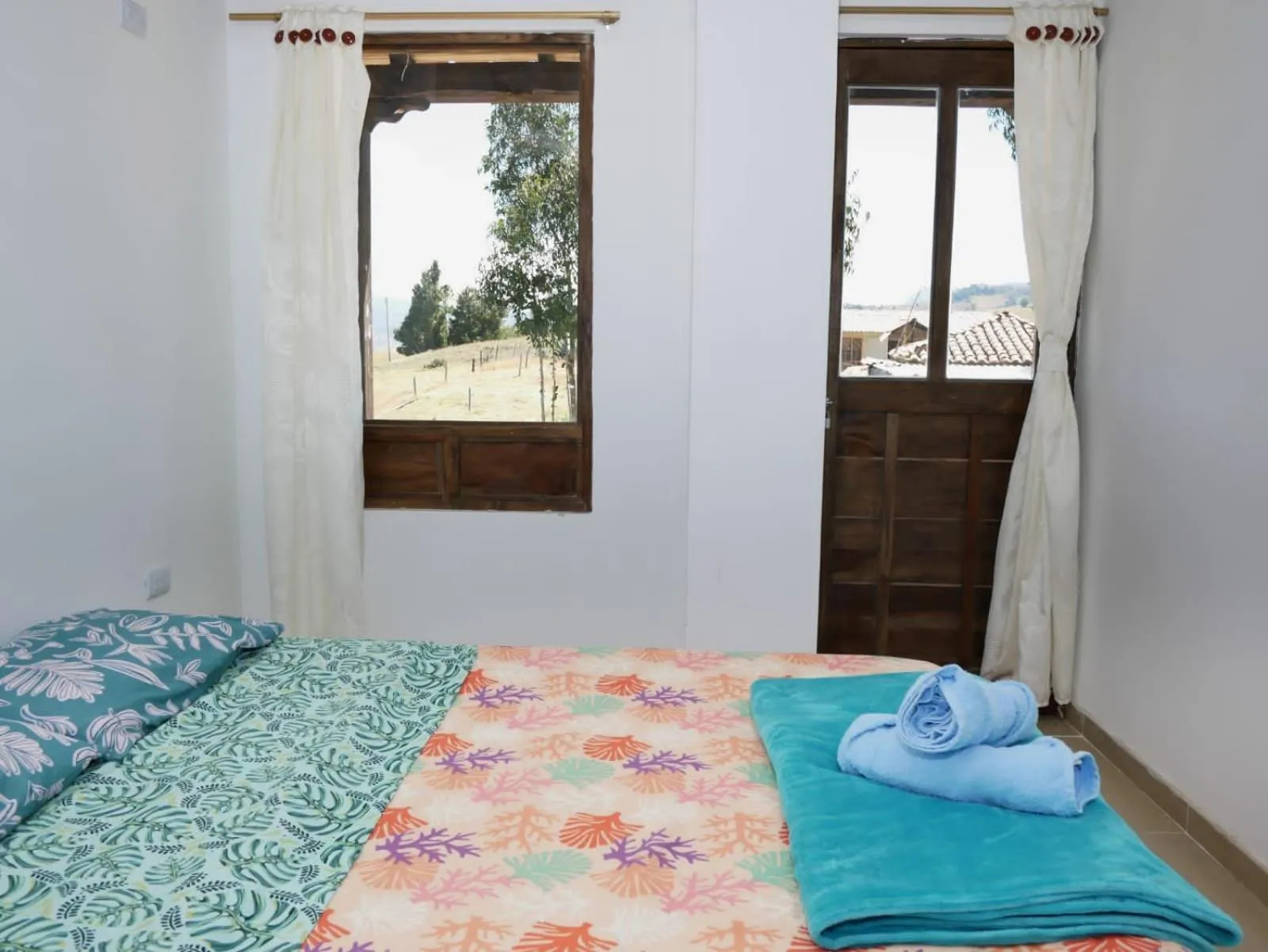 Bed in HOTEL TOTA ELISEO PLAYA BLANCA LAGO DE TOTA