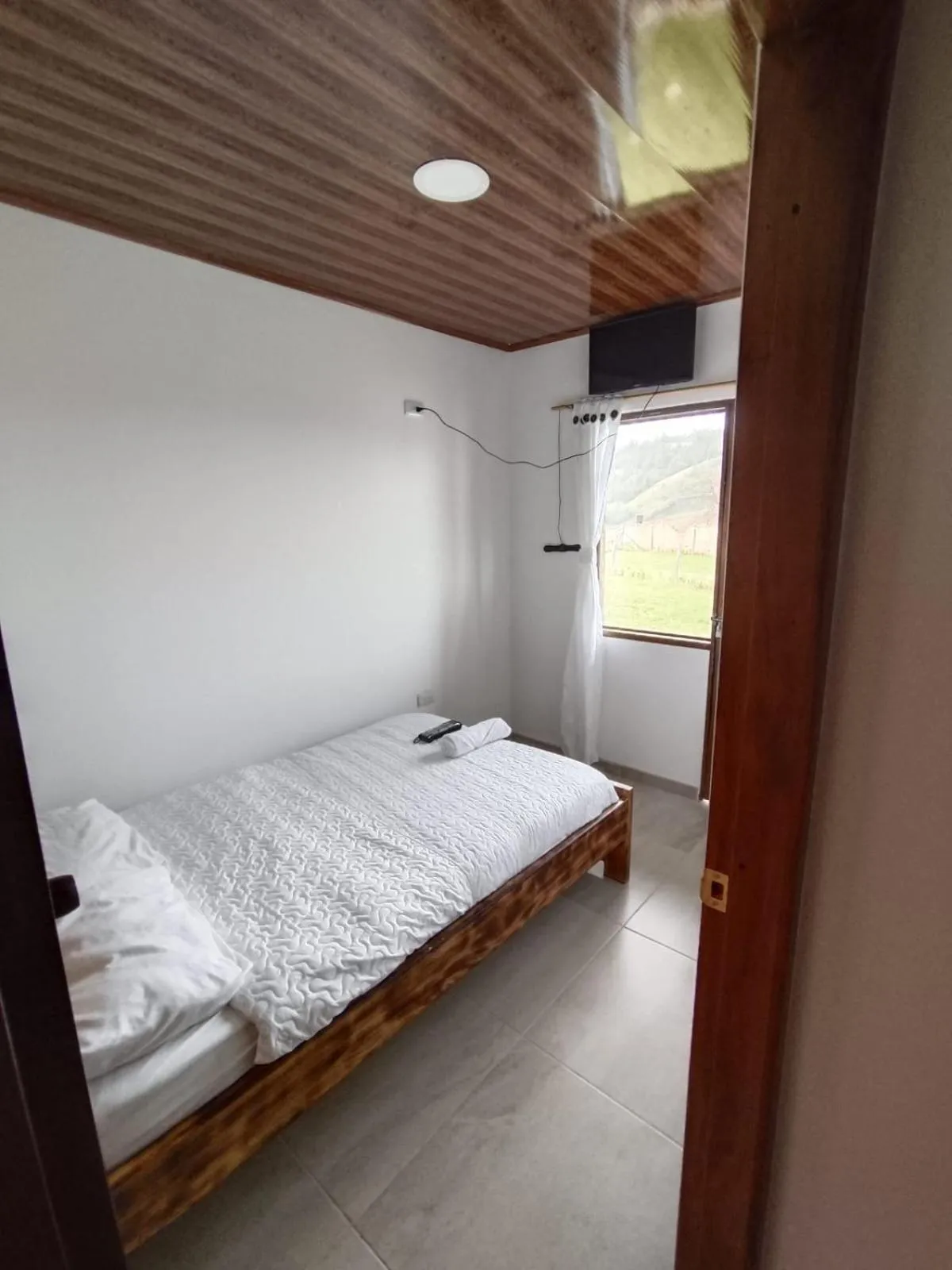 Bed in HOTEL TOTA ELISEO PLAYA BLANCA LAGO DE TOTA