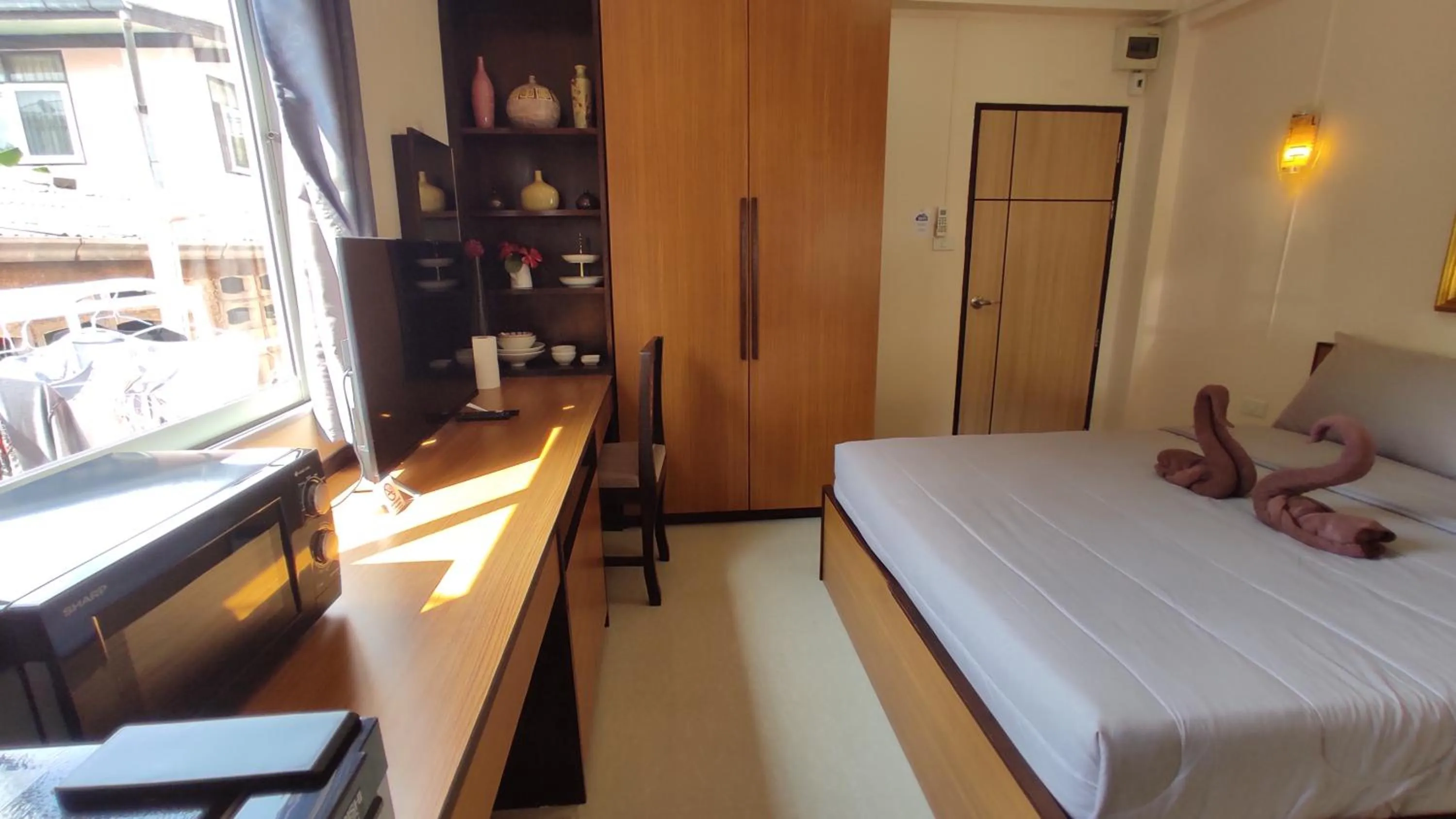 TV and multimedia, Bed in 66 Apartment