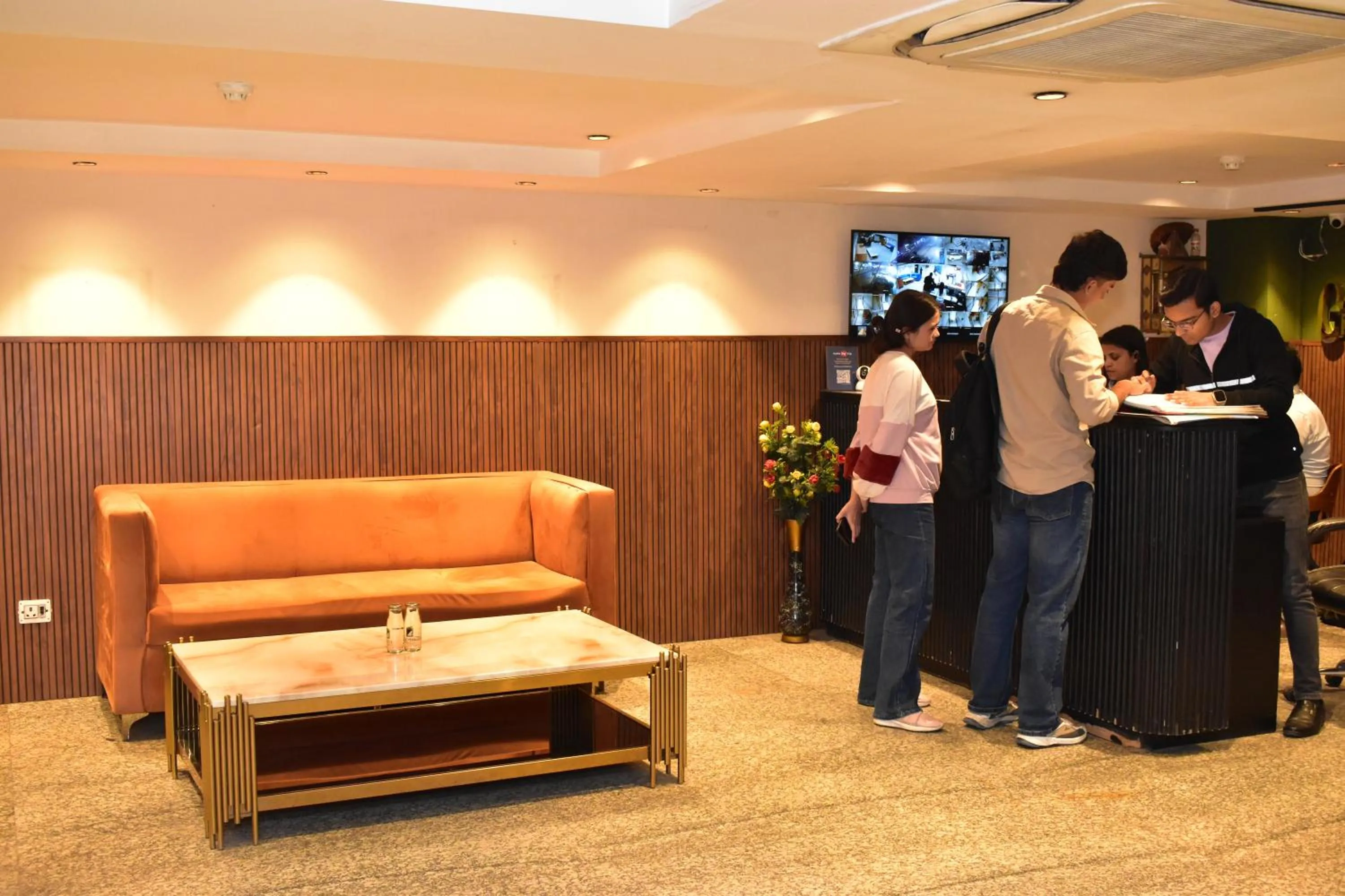 group of guests in Qotel Comfort Golden Saffron Punjabi Bagh New Delhi