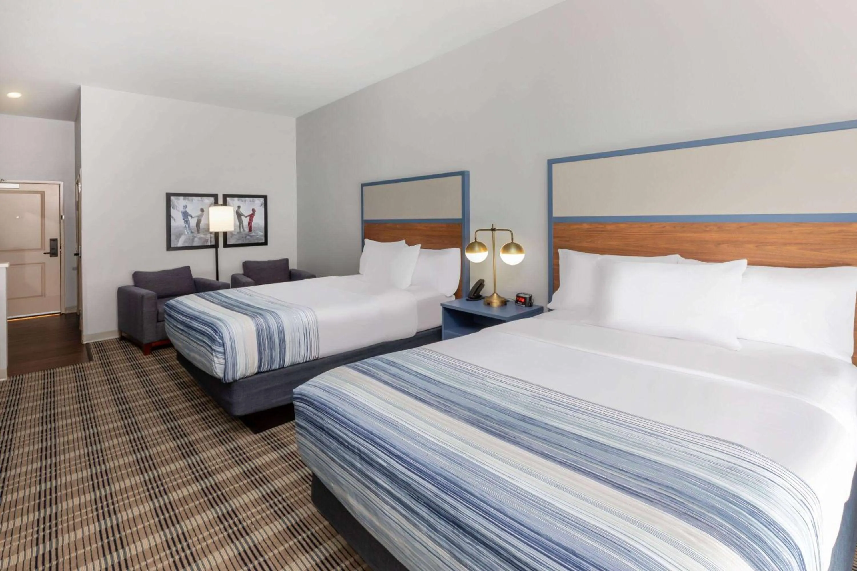 Bed in AmericInn by Wyndham Mountain Home