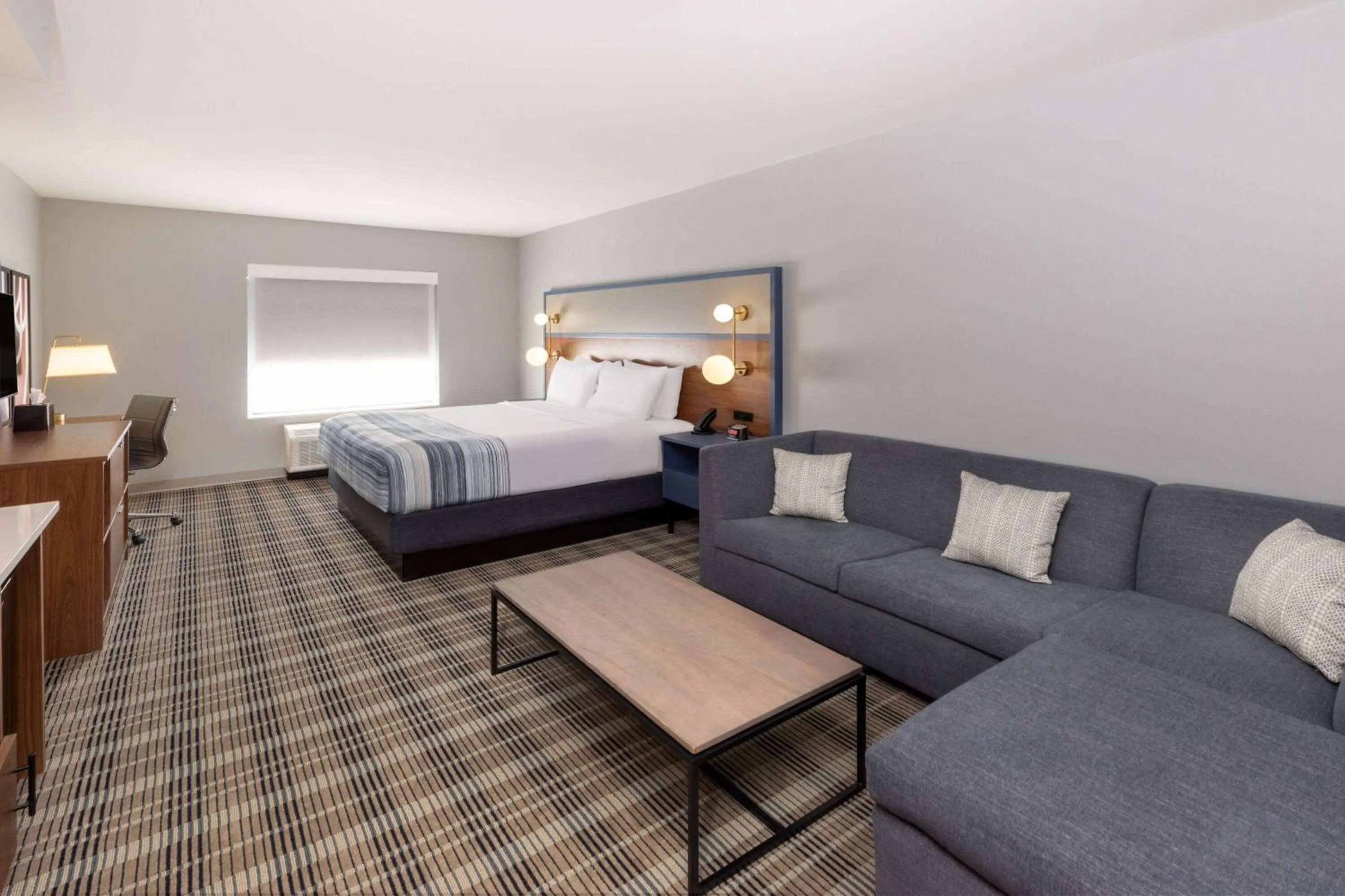 Bed in AmericInn by Wyndham Mountain Home