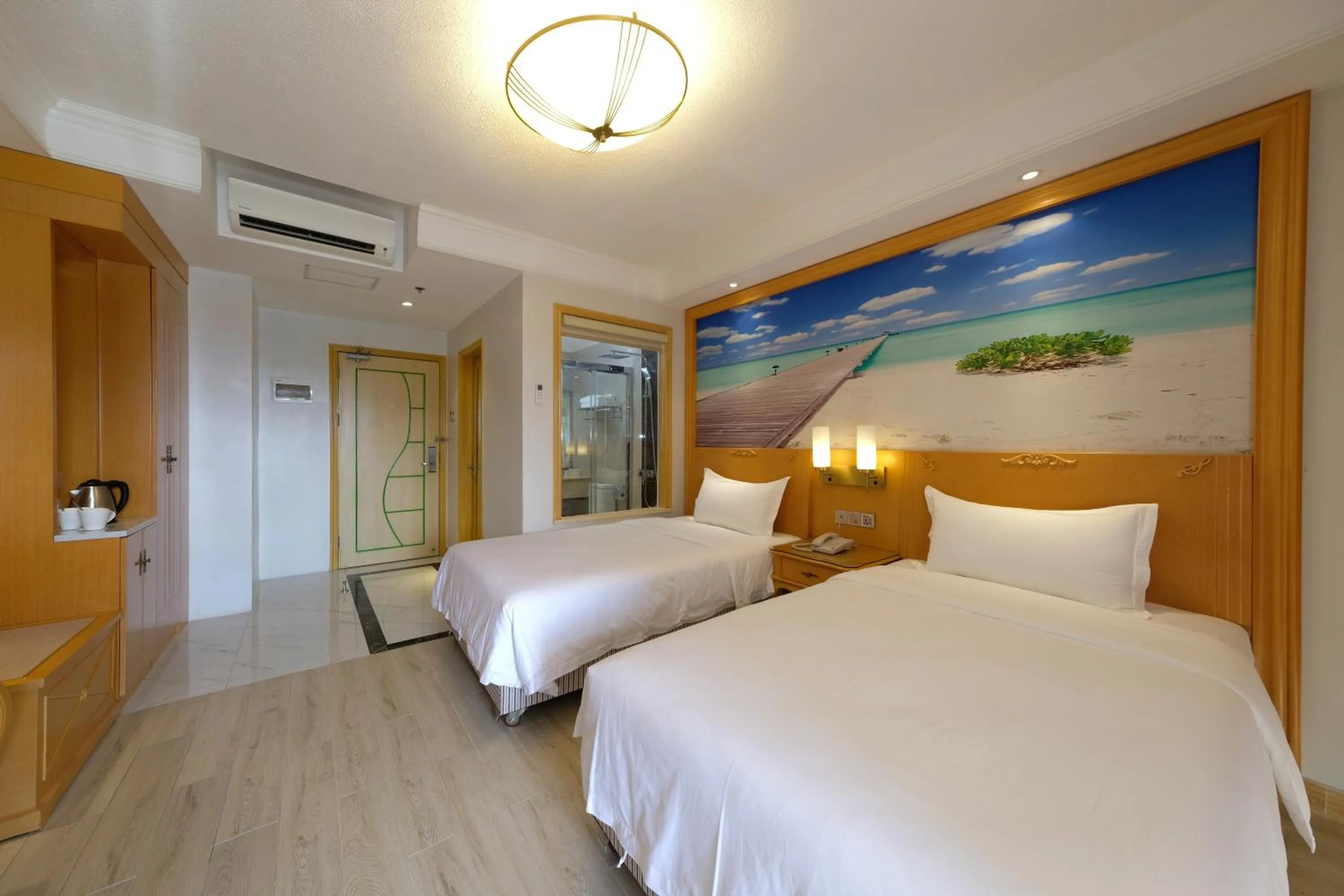 Bed in ROYAL J HOTEL