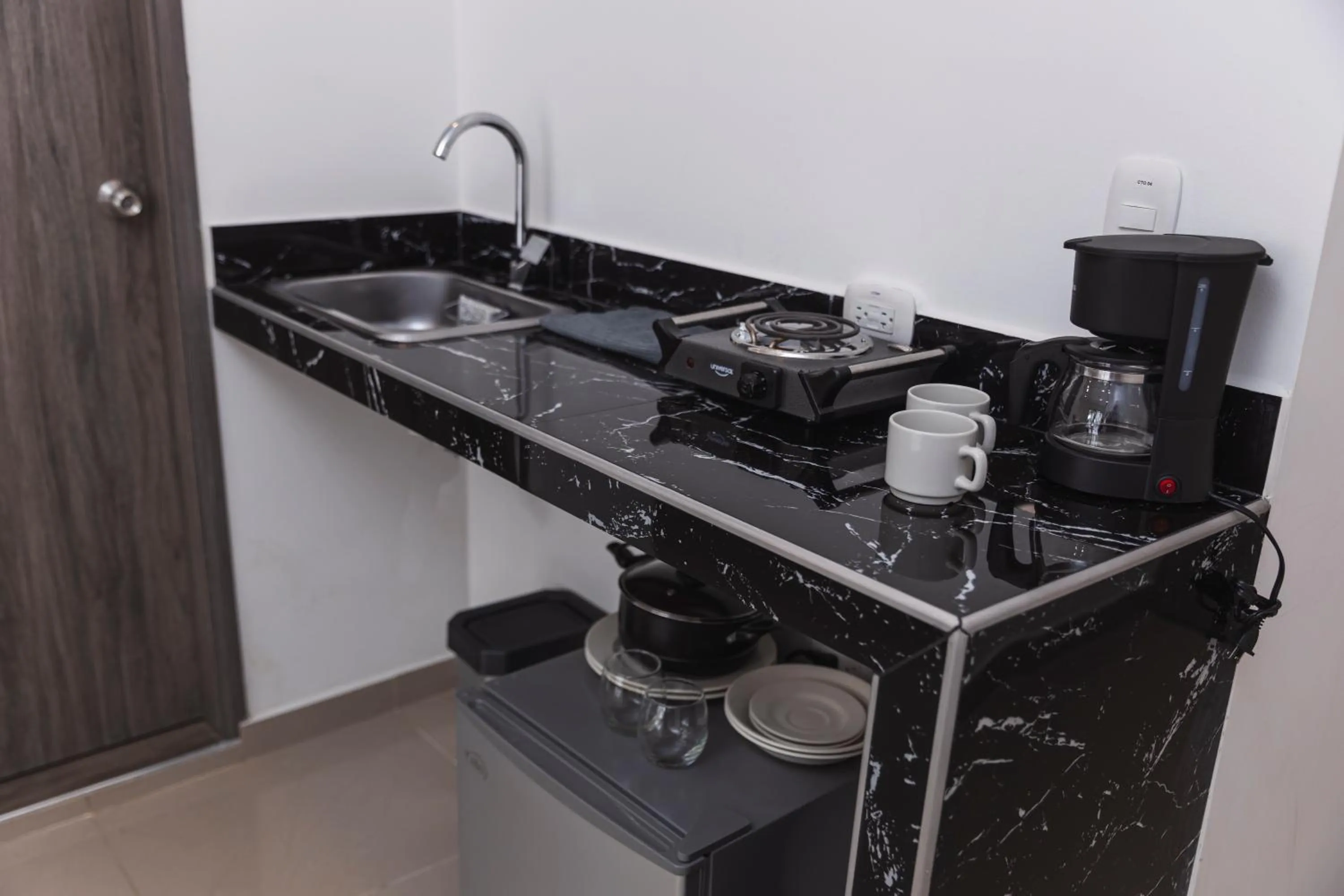 Kitchen or kitchenette in Hotel Boutique Business Center