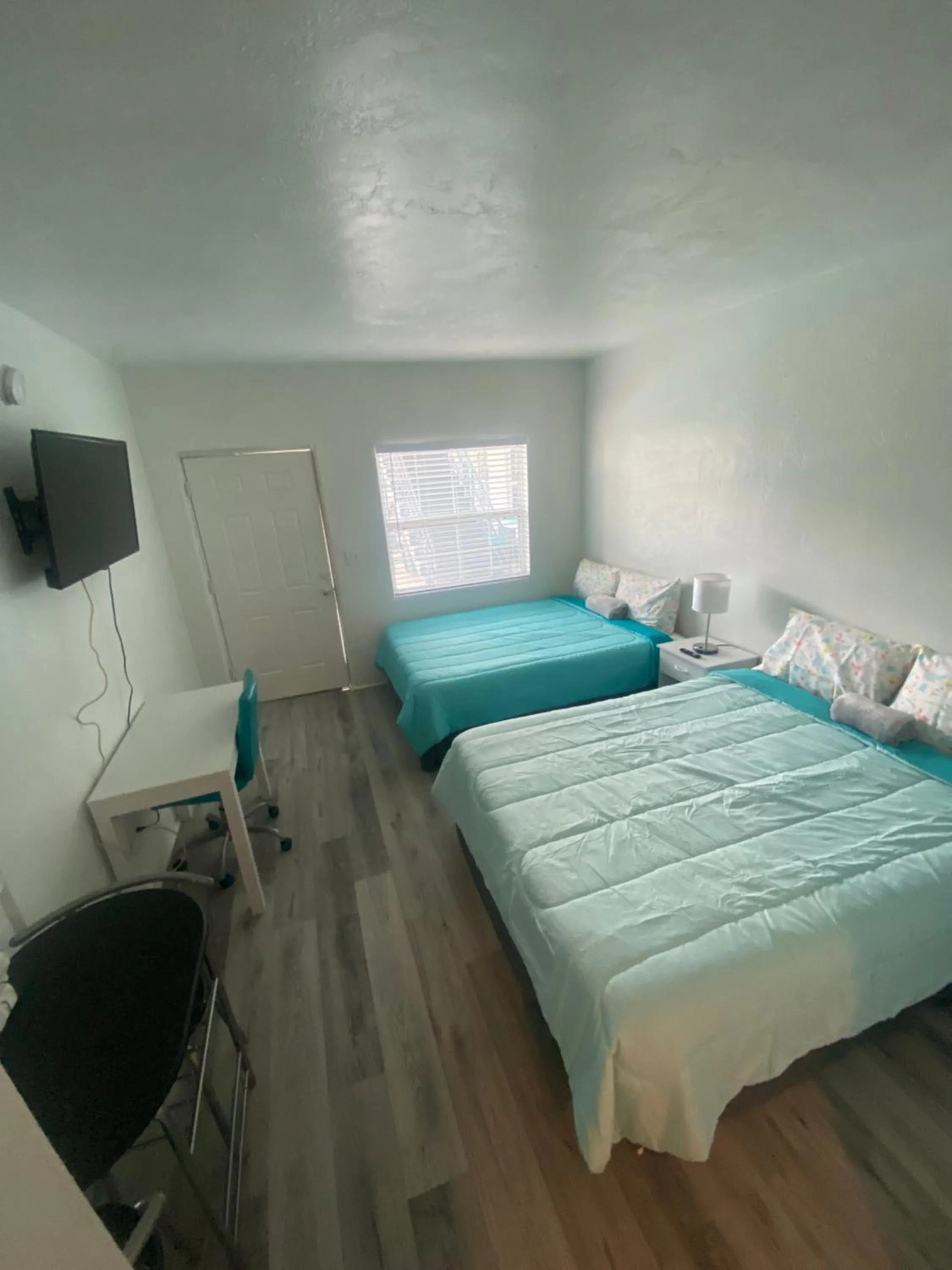 Bed in Uptown Inn & Suites