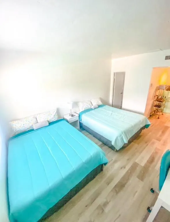 Bed in Uptown Inn & Suites